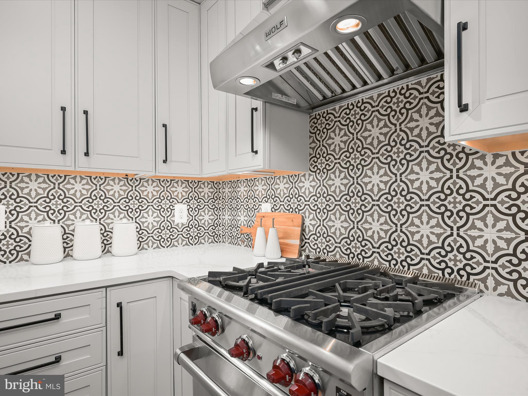 3118 17th Street North Arlington, VA 22201 - Photo 24 of 96 a stove top oven sitting inside of a kitchen