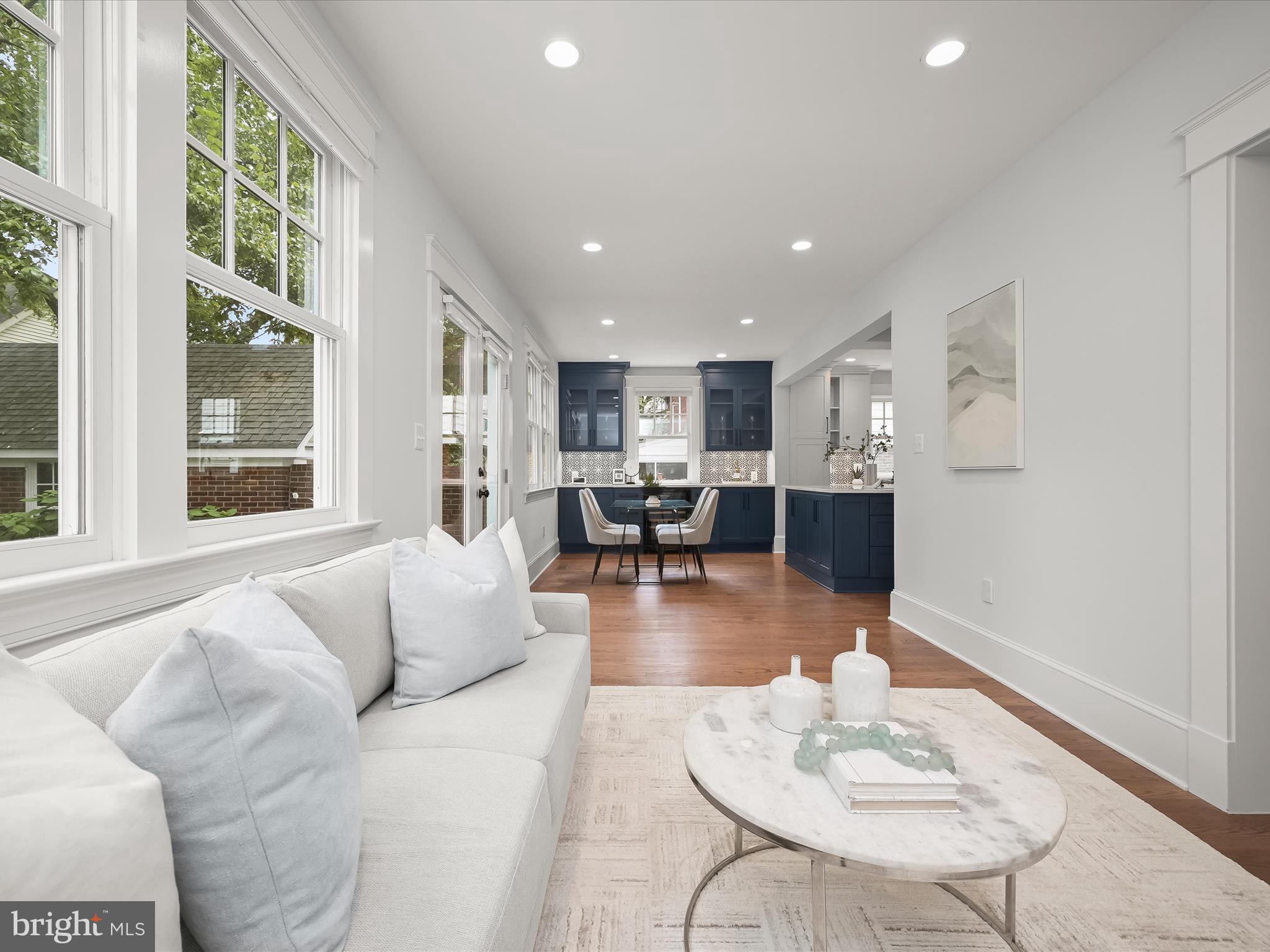 3118 17th Street North Arlington, VA 22201 - Photo 29 of 96 a living room with furniture and kitchen view