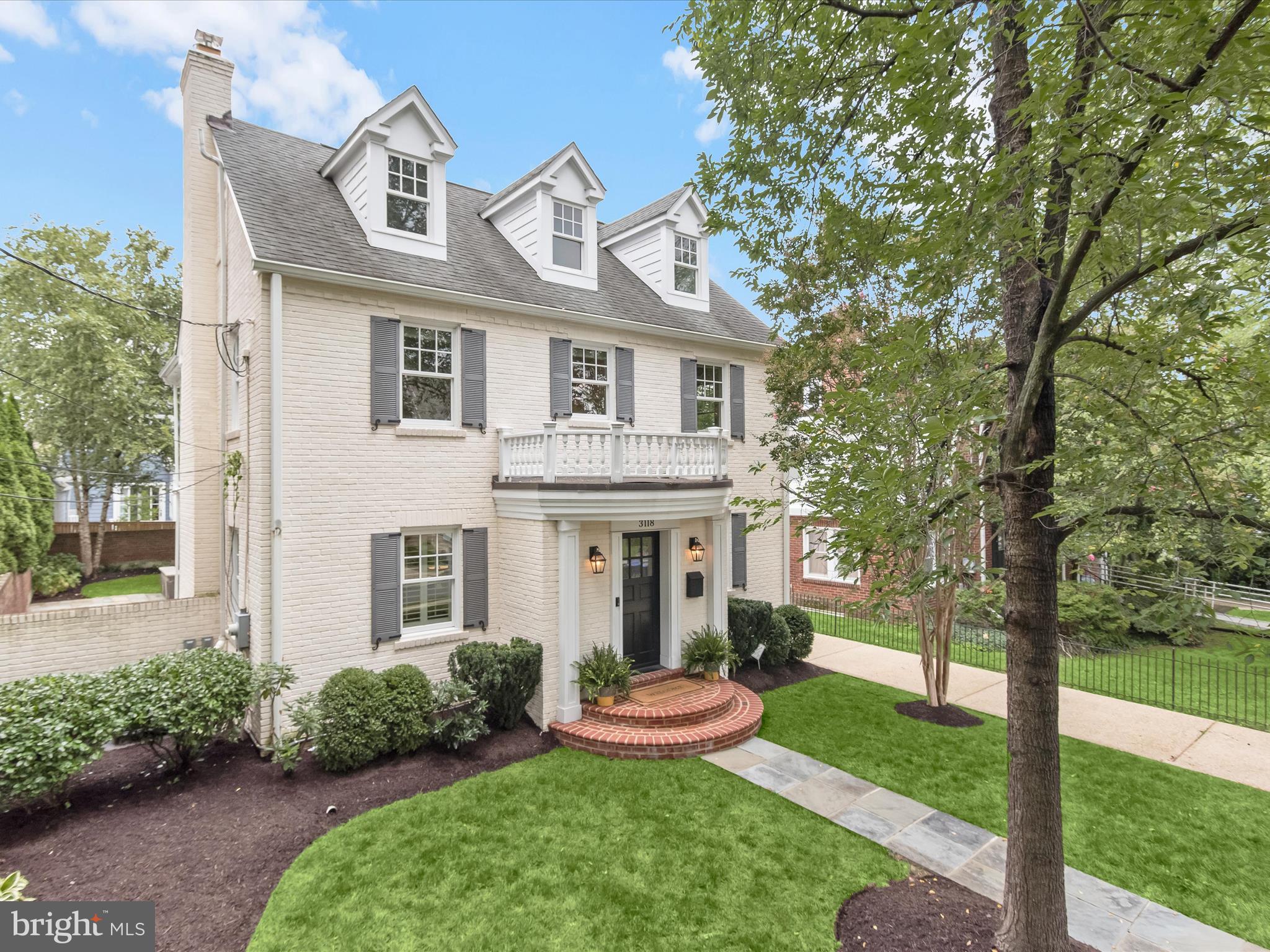 3118 17th Street North Arlington, VA 22201 - Photo 3 of 96 a front view of a house with a yard and potted plants