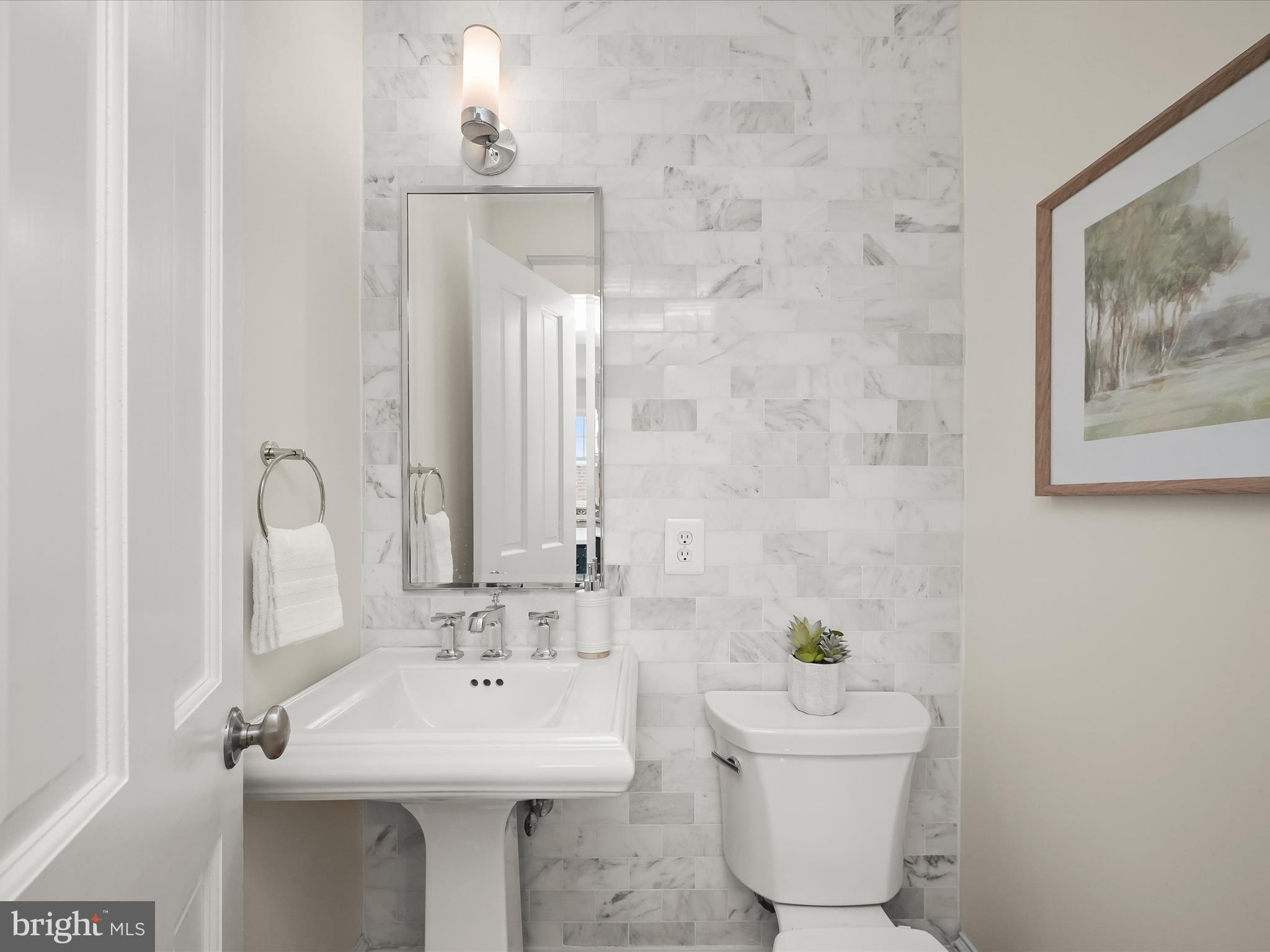 3118 17th Street North Arlington, VA 22201 - Photo 32 of 96 a bathroom with a sink mirror and toilet