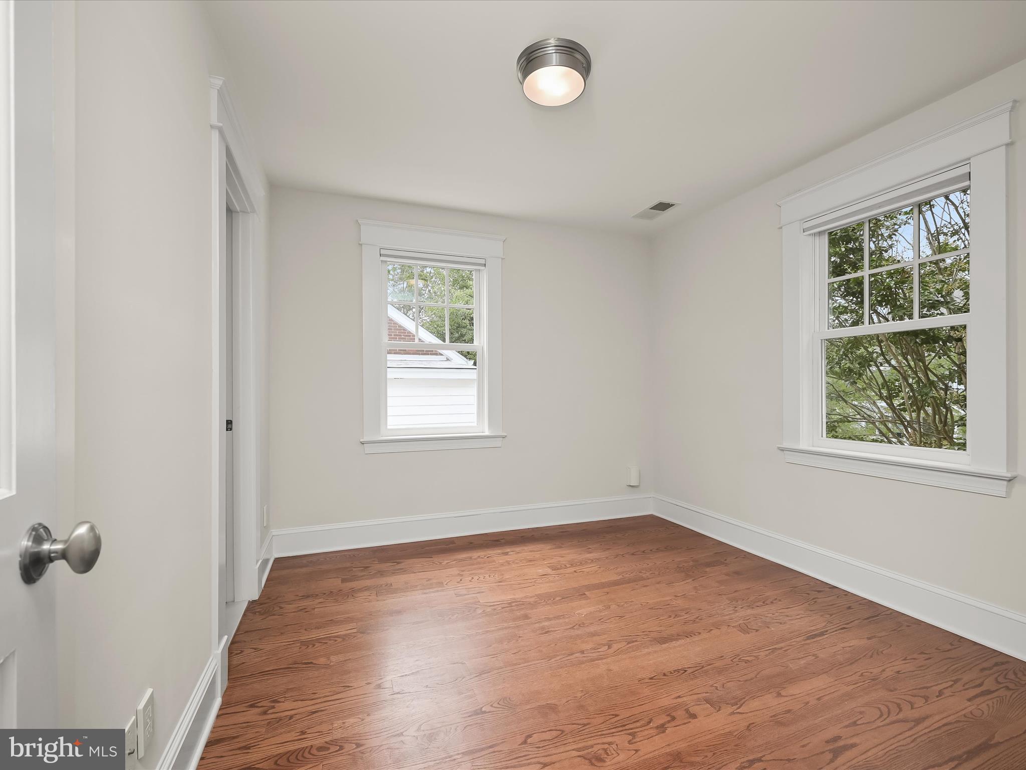 3118 17th Street North Arlington, VA 22201 - Photo 43 of 96 an empty room with wooden floor and windows