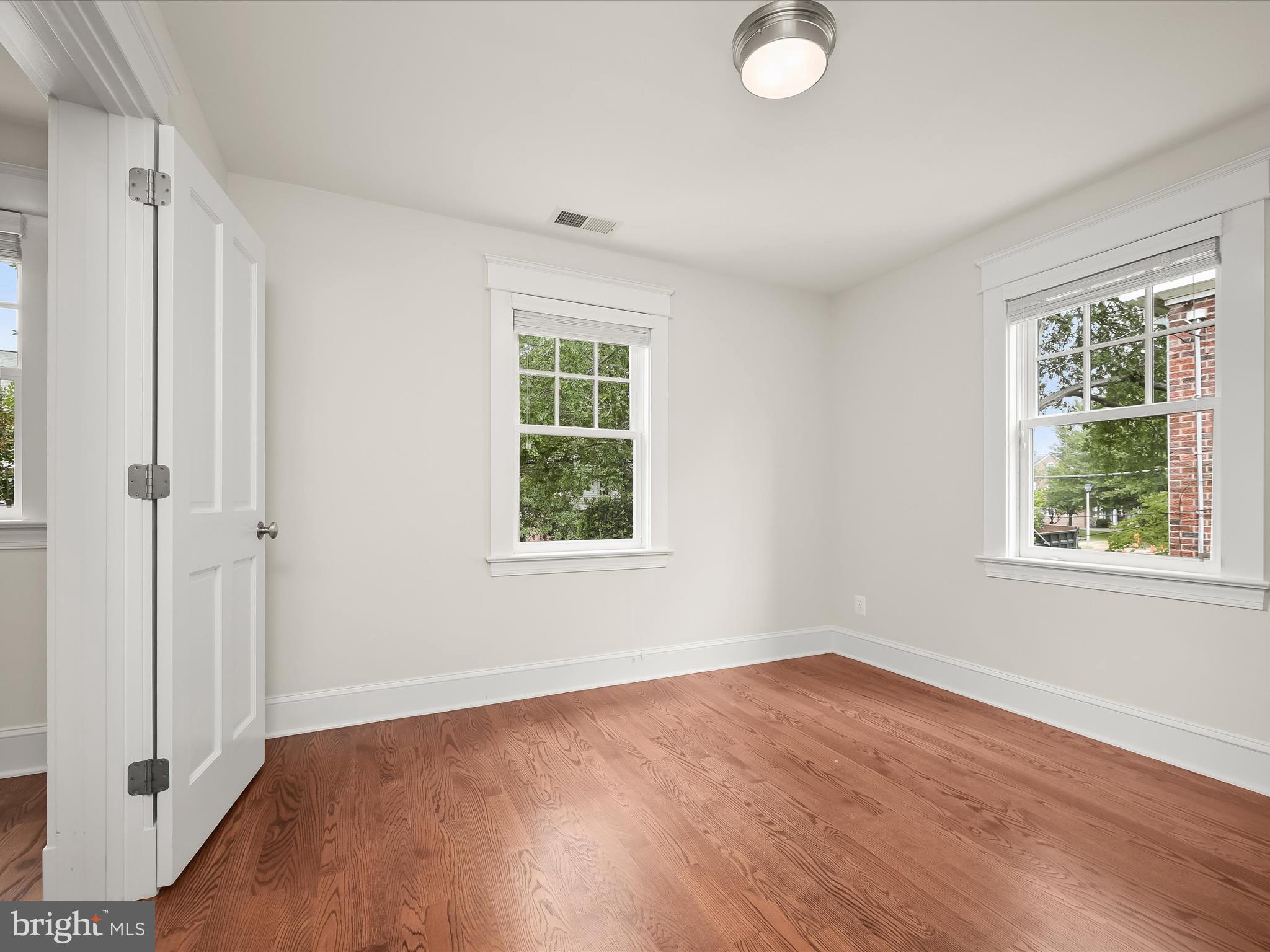3118 17th Street North Arlington, VA 22201 - Photo 46 of 96 an empty room with wooden floor and windows