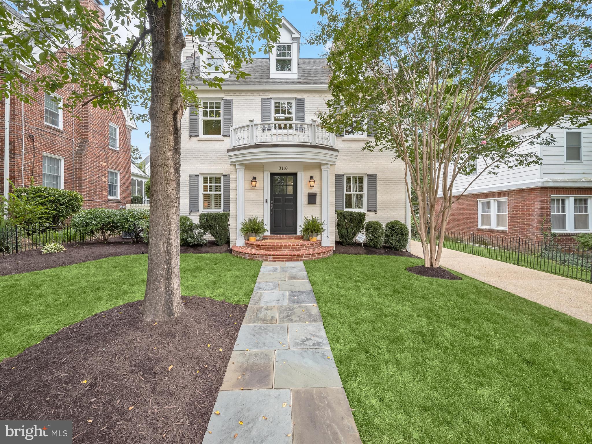 3118 17th Street North Arlington, VA 22201 - Photo 5 of 96 a front view of a house with a yard and potted plants