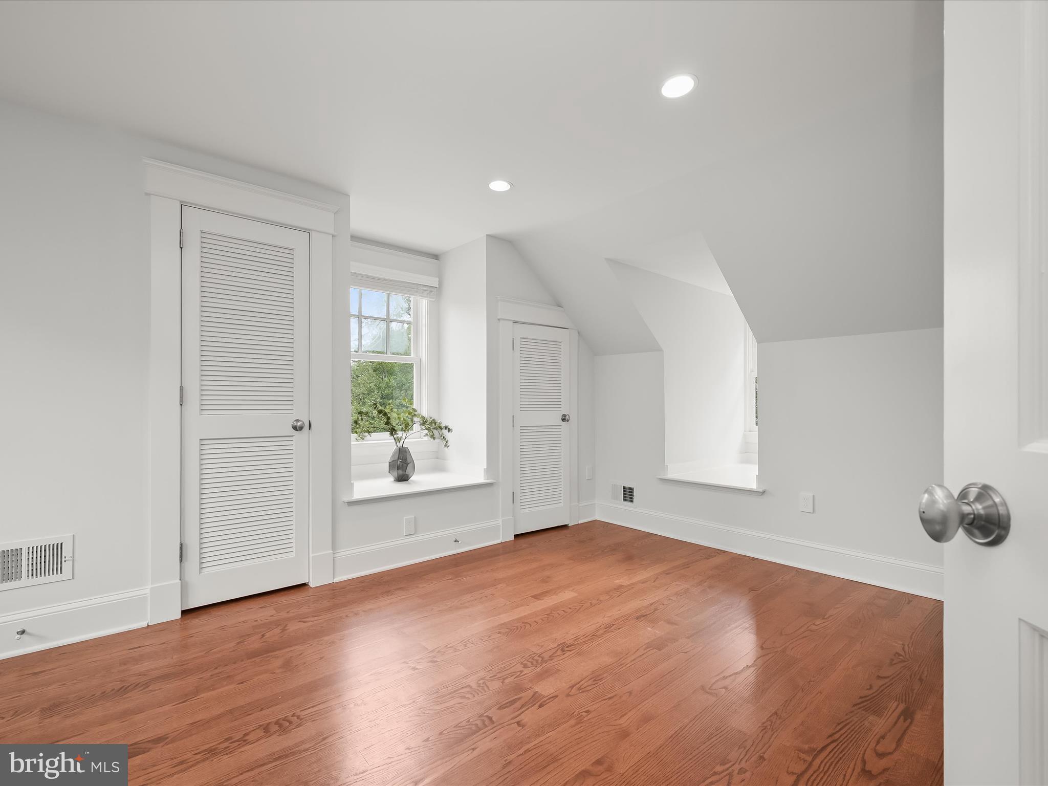 3118 17th Street North Arlington, VA 22201 - Photo 55 of 96 an empty room with wooden floor and windows