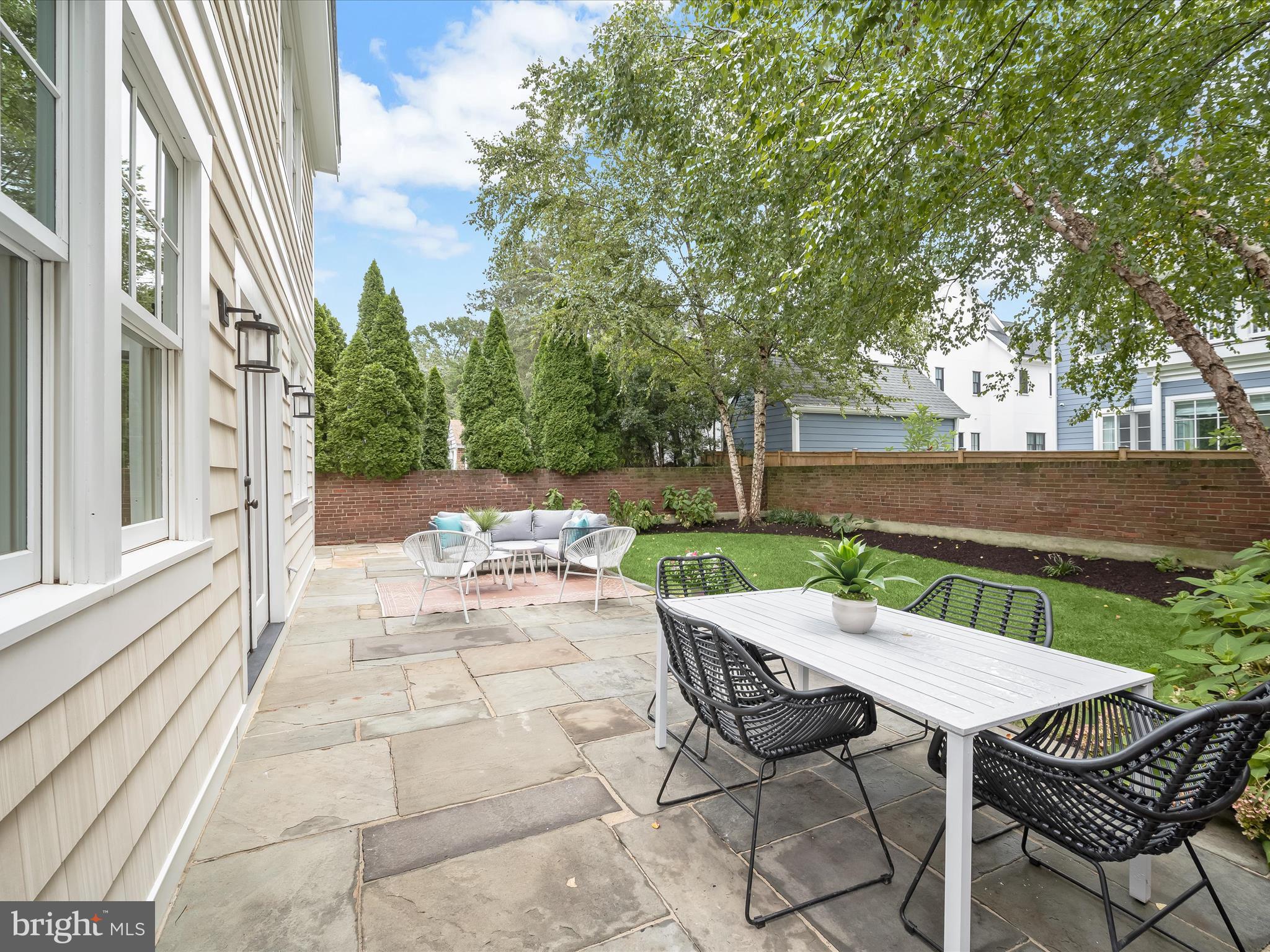 3118 17th Street North Arlington, VA 22201 - Photo 66 of 96 a view of a patio with table and chairs next to a yard