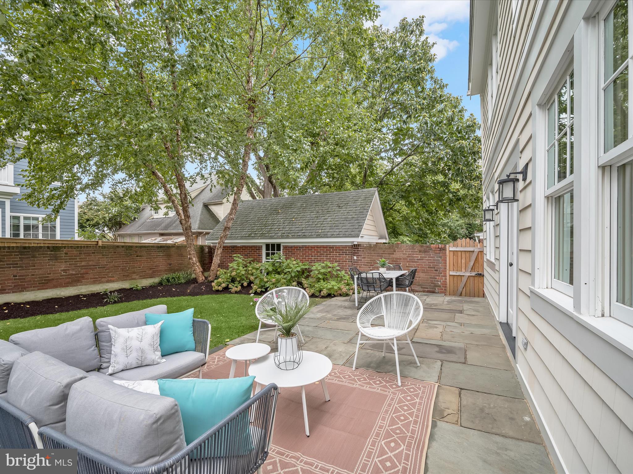 3118 17th Street North Arlington, VA 22201 - Photo 68 of 96 a view of a patio with couches table and chairs and potted plants