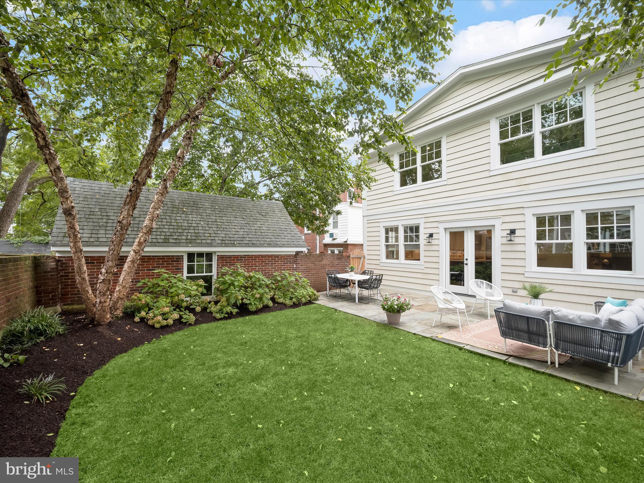 3118 17th Street North Arlington, VA 22201 - Photo 74 of 96 a front view of house with a garden and patio