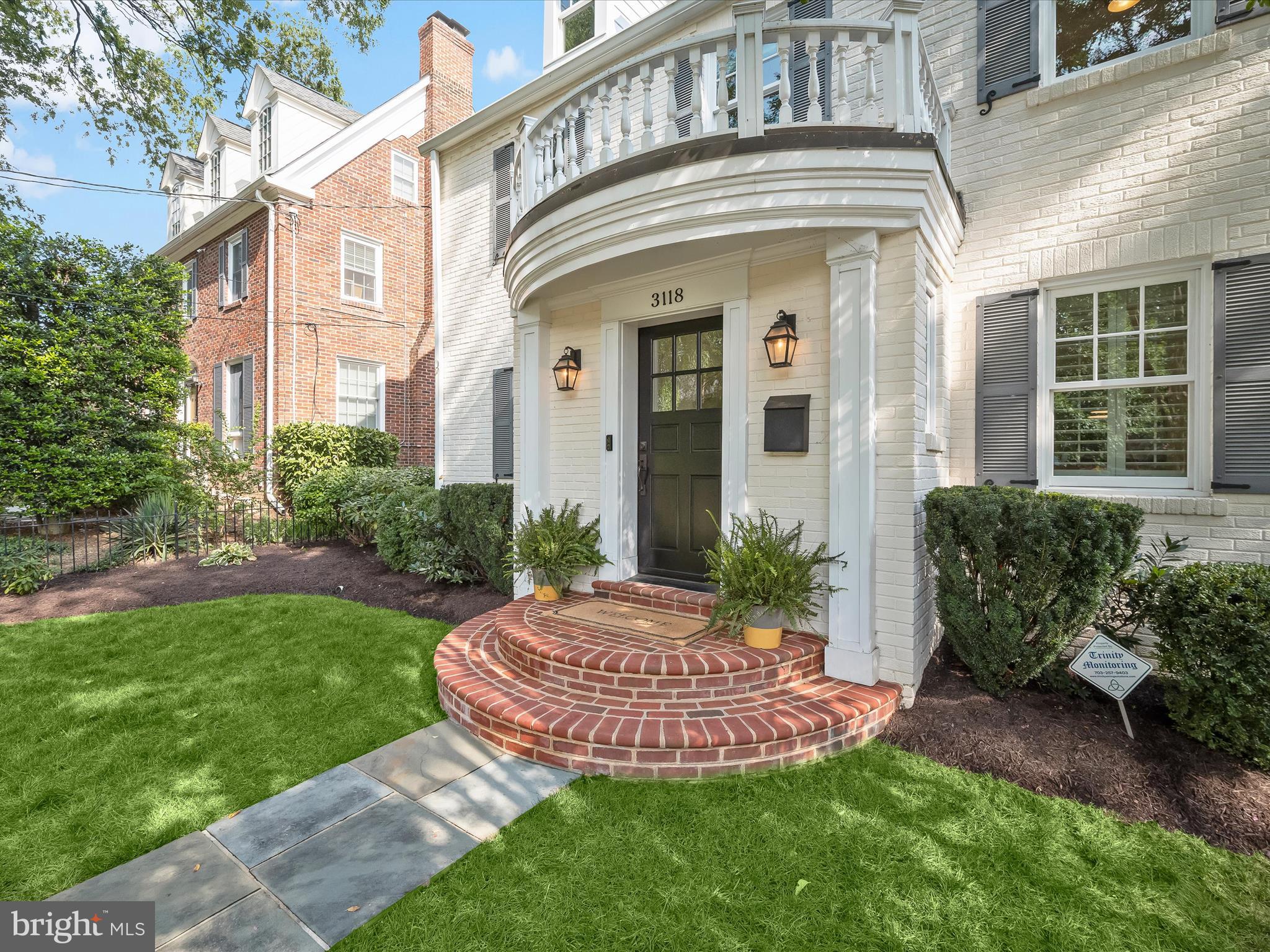 3118 17th Street North Arlington, VA 22201 - Photo 8 of 96 a view of a house with brick walls and a yard with plants