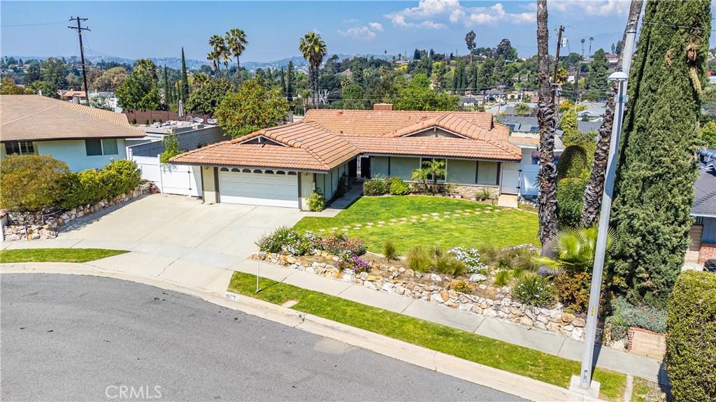 23711 Silver Spray Drive Diamond Bar, CA 91765 - Photo 12 of 49 a aerial view of a house with a yard and potted plants