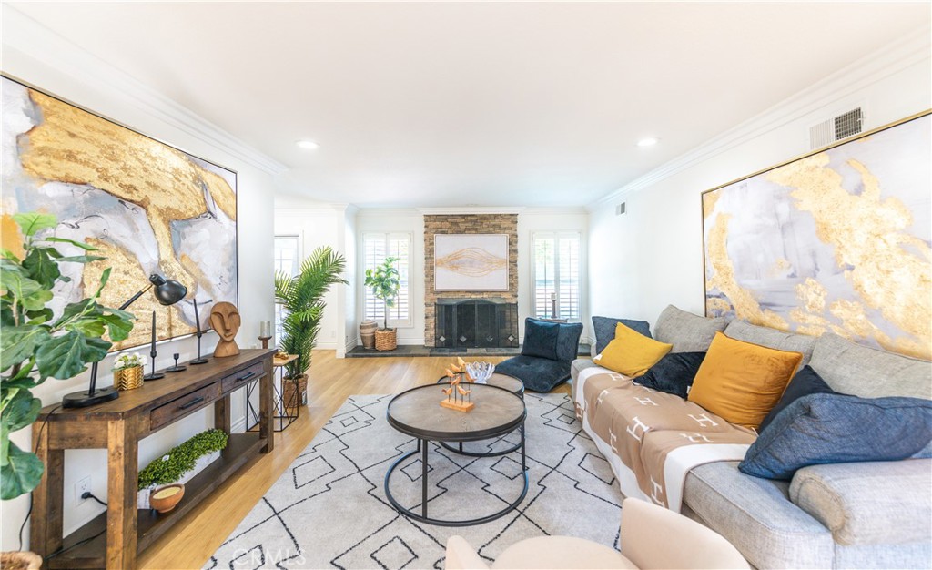 23711 Silver Spray Drive Diamond Bar, CA 91765 - Photo 14 of 49 a living room with furniture potted plant and a large window