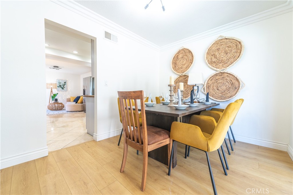 23711 Silver Spray Drive Diamond Bar, CA 91765 - Photo 17 of 49 a dining room with furniture and a clock