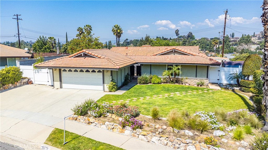 23711 Silver Spray Drive Diamond Bar, CA 91765 - Photo 2 of 49 a front view of a house with a garden