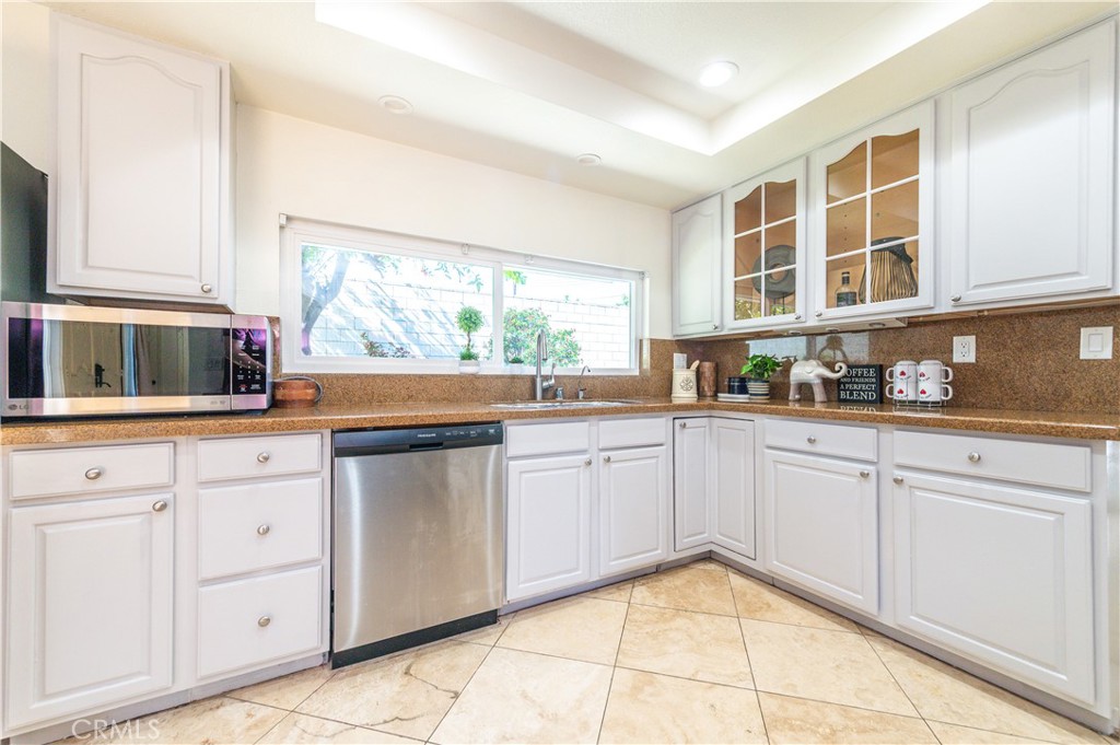23711 Silver Spray Drive Diamond Bar, CA 91765 - Photo 22 of 49 a kitchen with stainless steel appliances granite countertop a stove and a sink