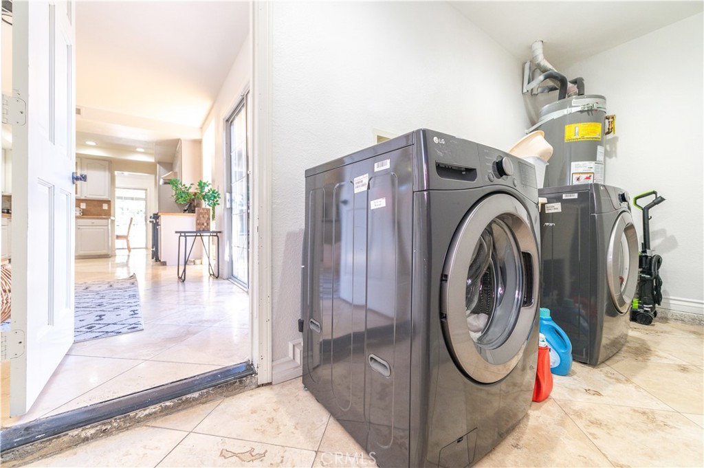 23711 Silver Spray Drive Diamond Bar, CA 91765 - Photo 36 of 49 a utility room with multiple dryer and washer