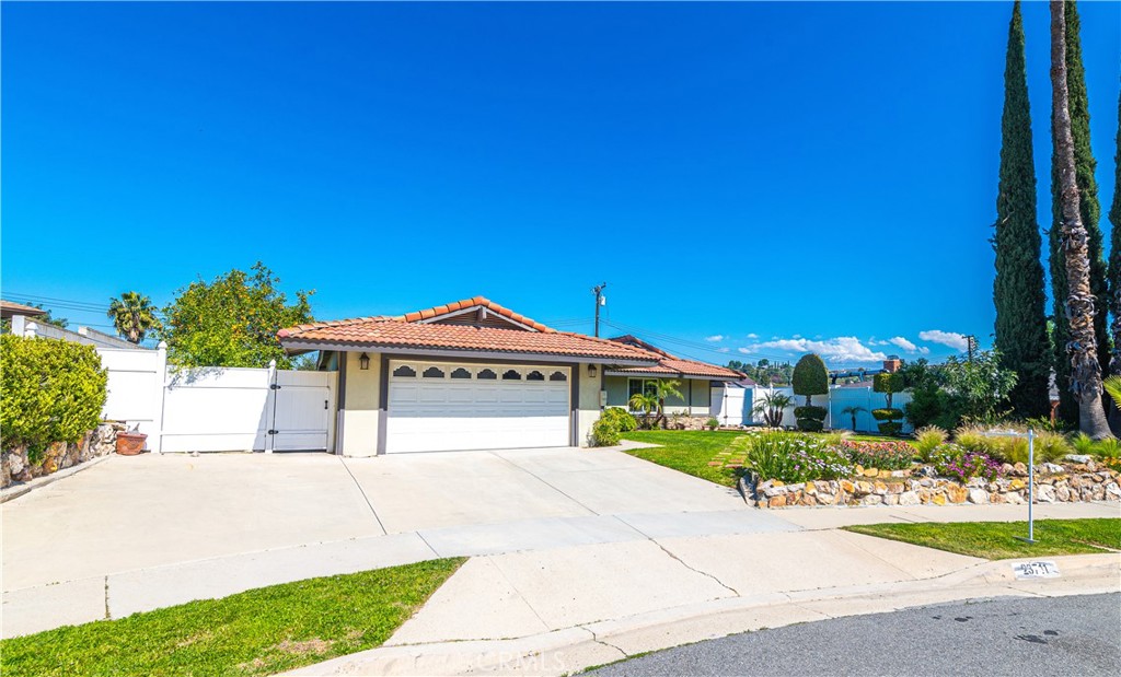 23711 Silver Spray Drive Diamond Bar, CA 91765 - Photo 48 of 49 a front view of a house with a garden