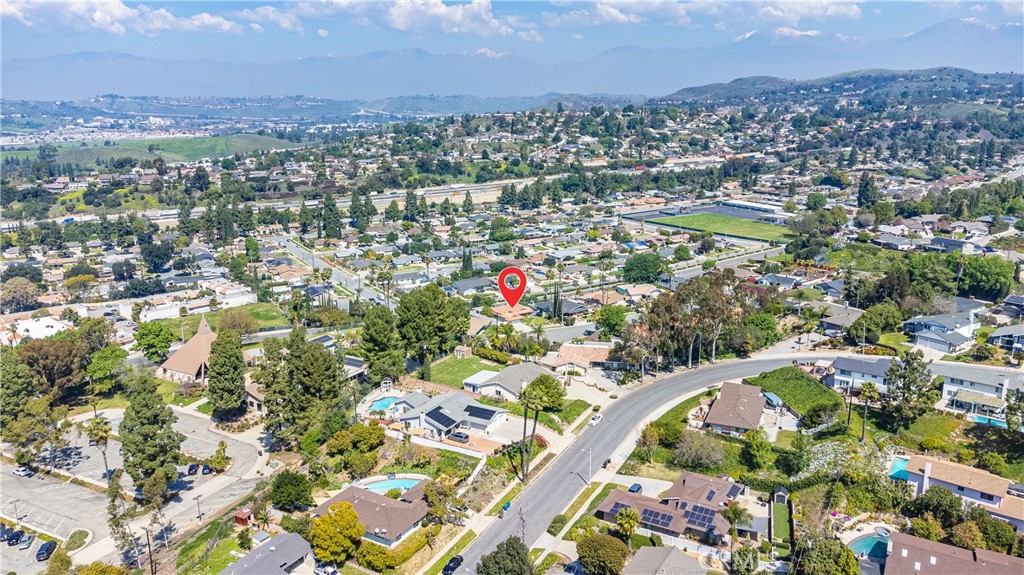 23711 Silver Spray Drive Diamond Bar, CA 91765 - Photo 9 of 49 an aerial view of residential houses with outdoor space and trees