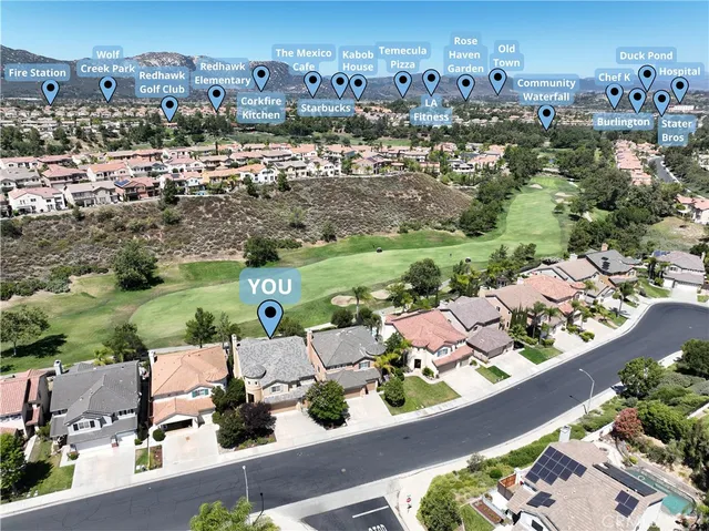 an aerial view of a house with yard swimming pool and outdoor seating