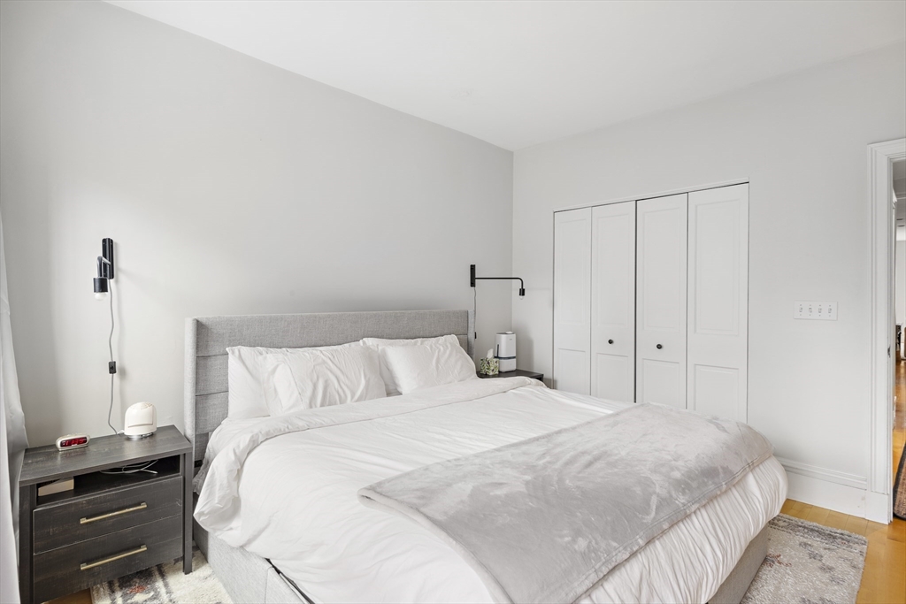 427 Shawmut Avenue, Unit 3 Boston, MA 02118 - Photo 17 of 26 a bedroom with a bed and a night stand