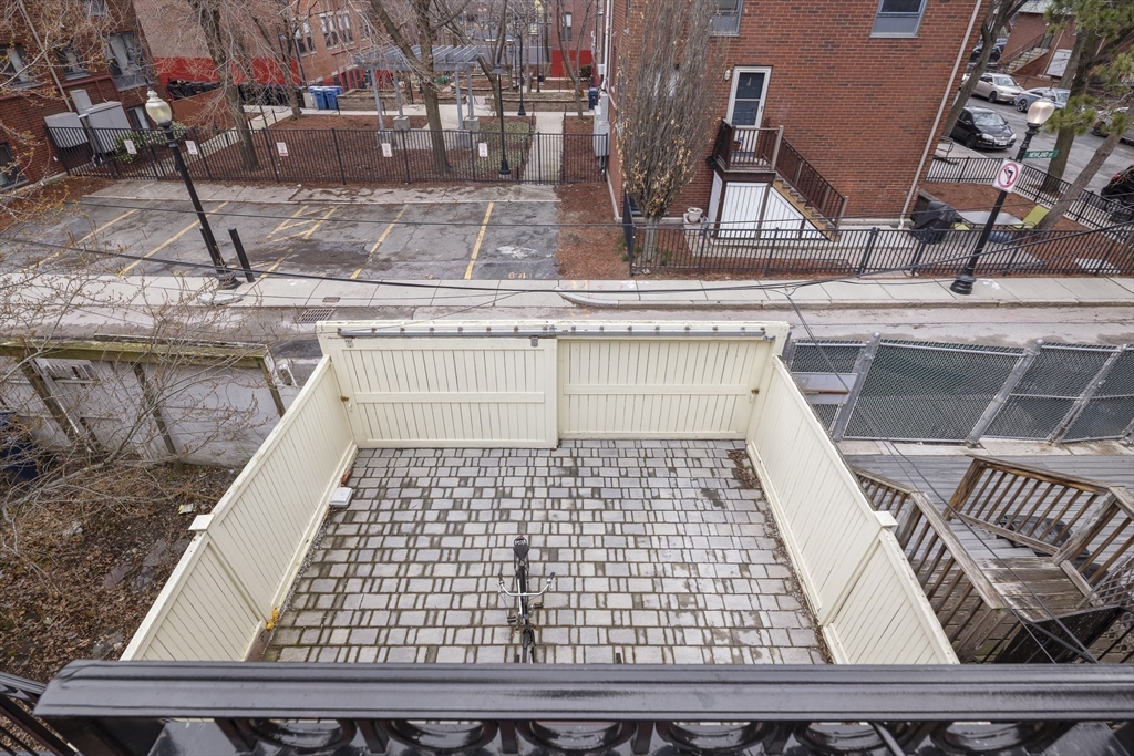 427 Shawmut Avenue, Unit 3 Boston, MA 02118 - Photo 24 of 26 a view of a balcony with wooden floor