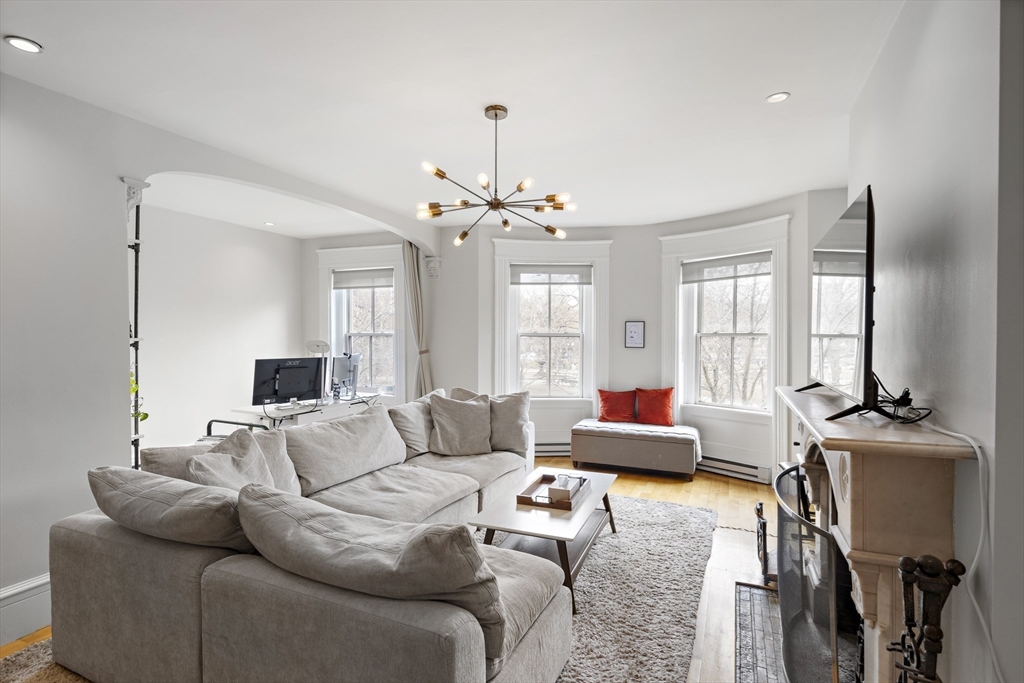 427 Shawmut Avenue, Unit 3 Boston, MA 02118 - Photo 3 of 26 a living room with furniture and wooden floor