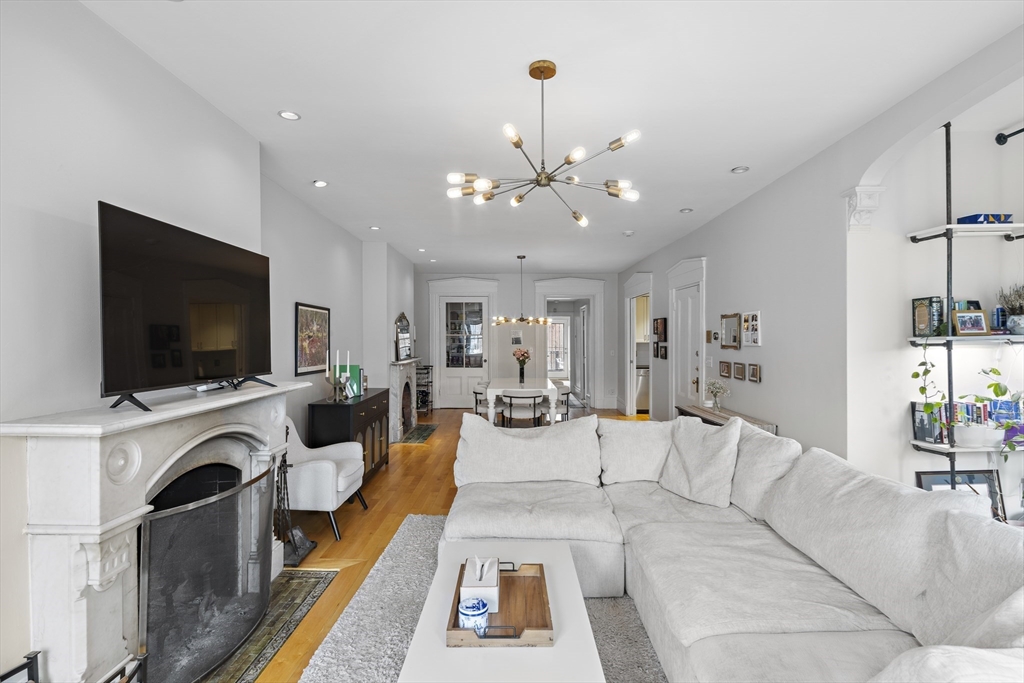 427 Shawmut Avenue, Unit 3 Boston, MA 02118 - Photo 4 of 26 a living room with furniture and a flat screen tv