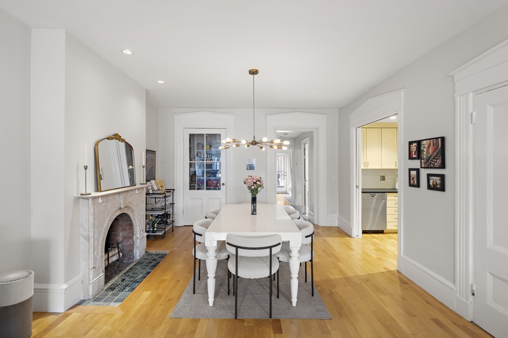 427 Shawmut Avenue, Unit 3 Boston, MA 02118 - Photo 7 of 26 a view of a dining room with furniture window and wooden floor