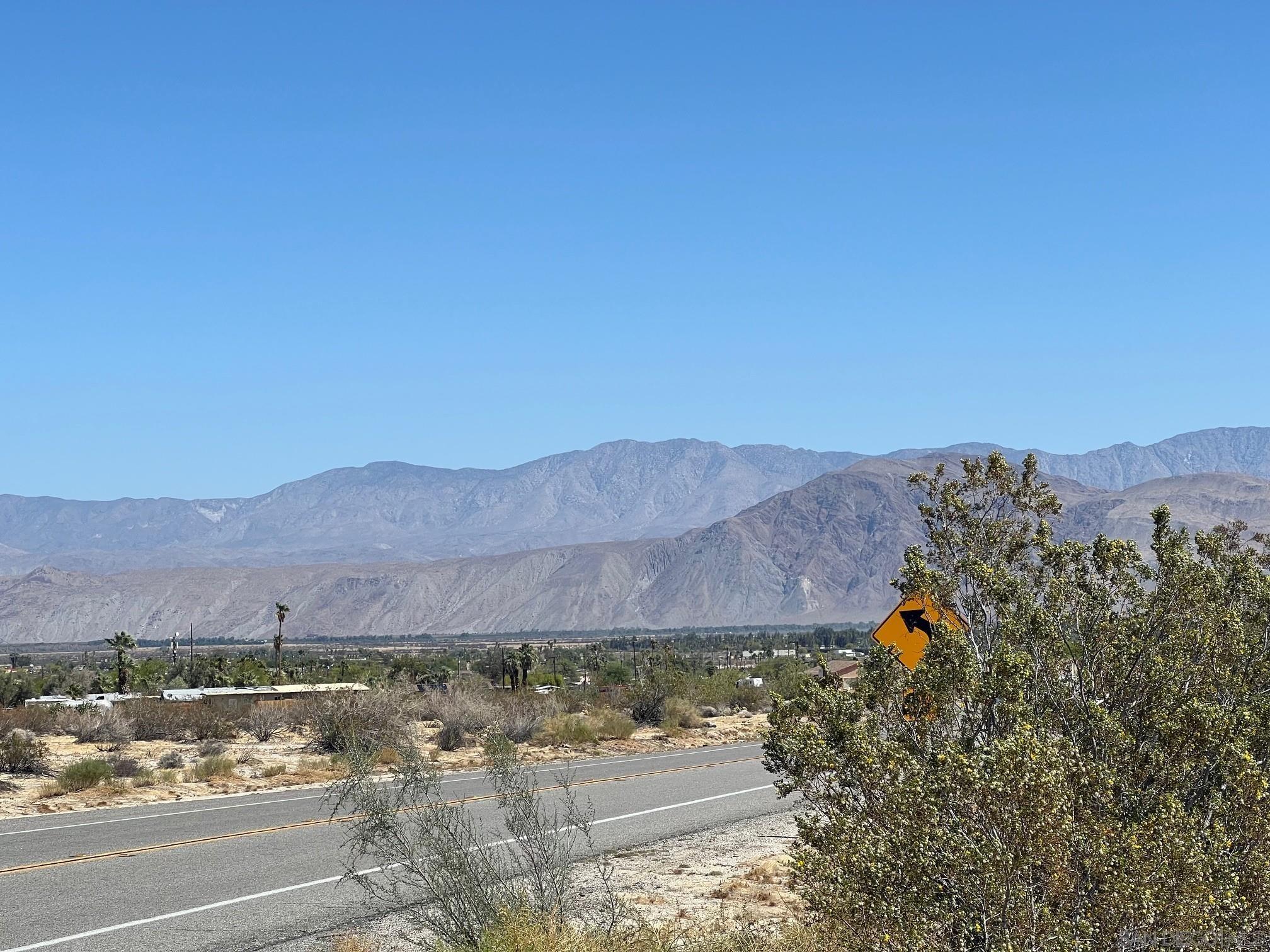 0 Borrego Springs Road, Unit 131 Borrego Springs, CA 92004 - Photo 4 of 10 a view of a house with a yard and a car park side of it