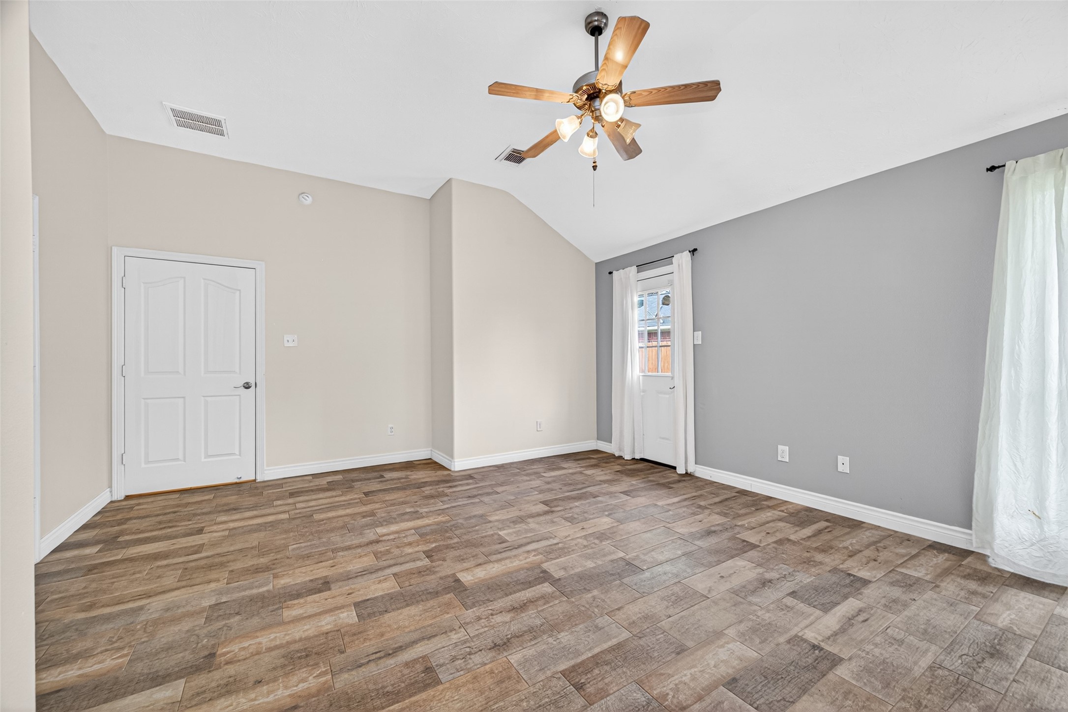 23914 Glengate Drive Spring, TX 77373 - Photo 20 of 49 a view of an empty room with a chandelier fan