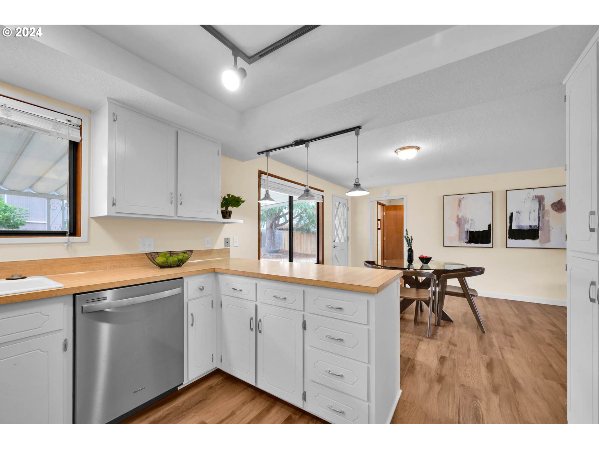 7136 B Street Springfield, OR 97478 - Photo 17 of 46 a kitchen with a sink cabinets and wooden floor