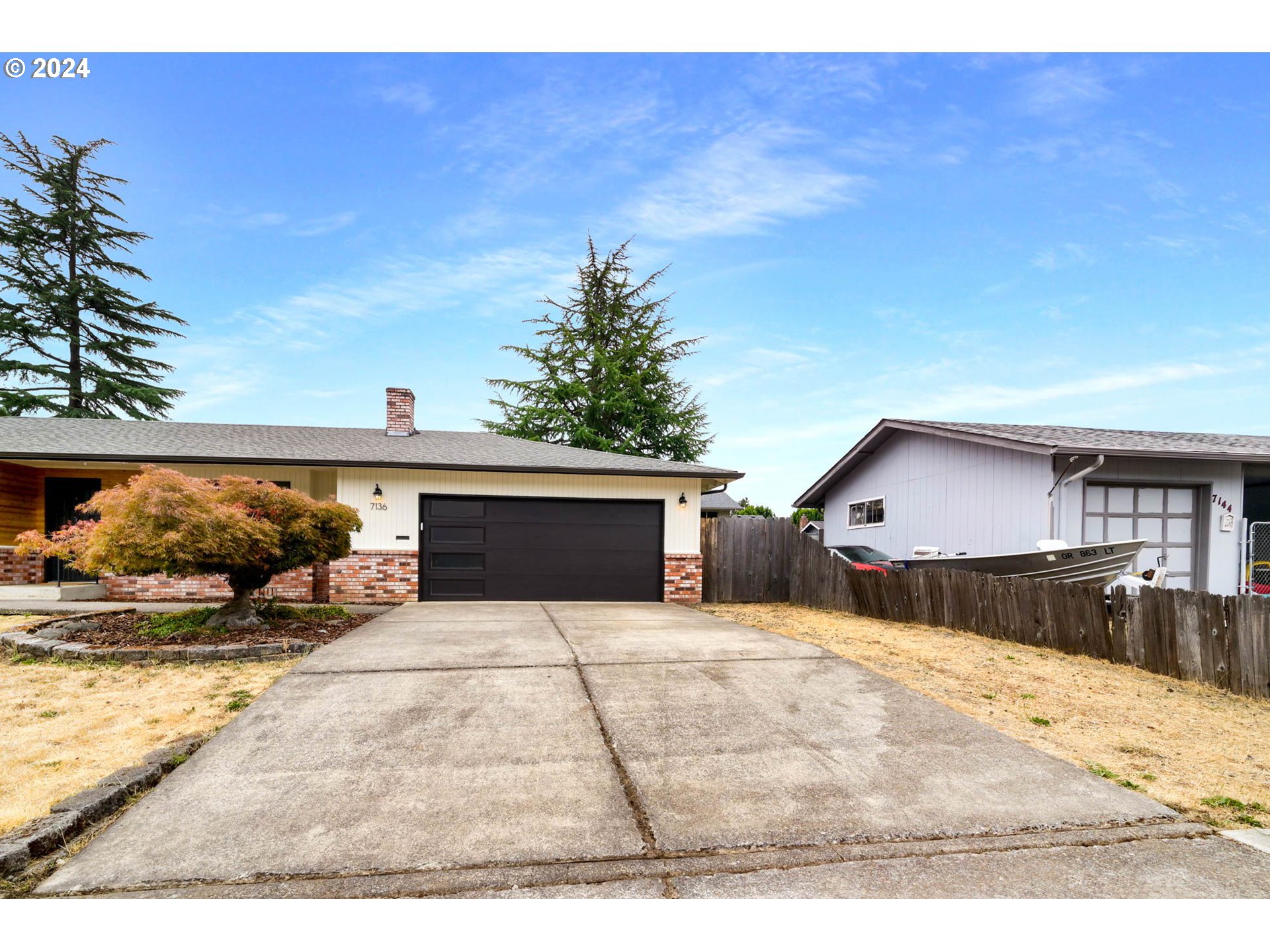 7136 B Street Springfield, OR 97478 - Photo 2 of 46 a view of a house with a yard