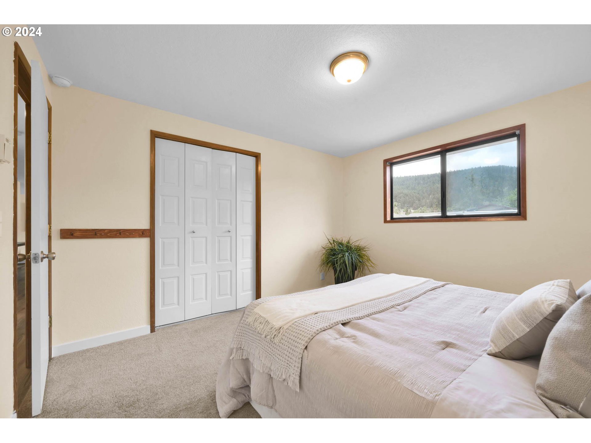 7136 B Street Springfield, OR 97478 - Photo 23 of 46 a bedroom with a bed and a window