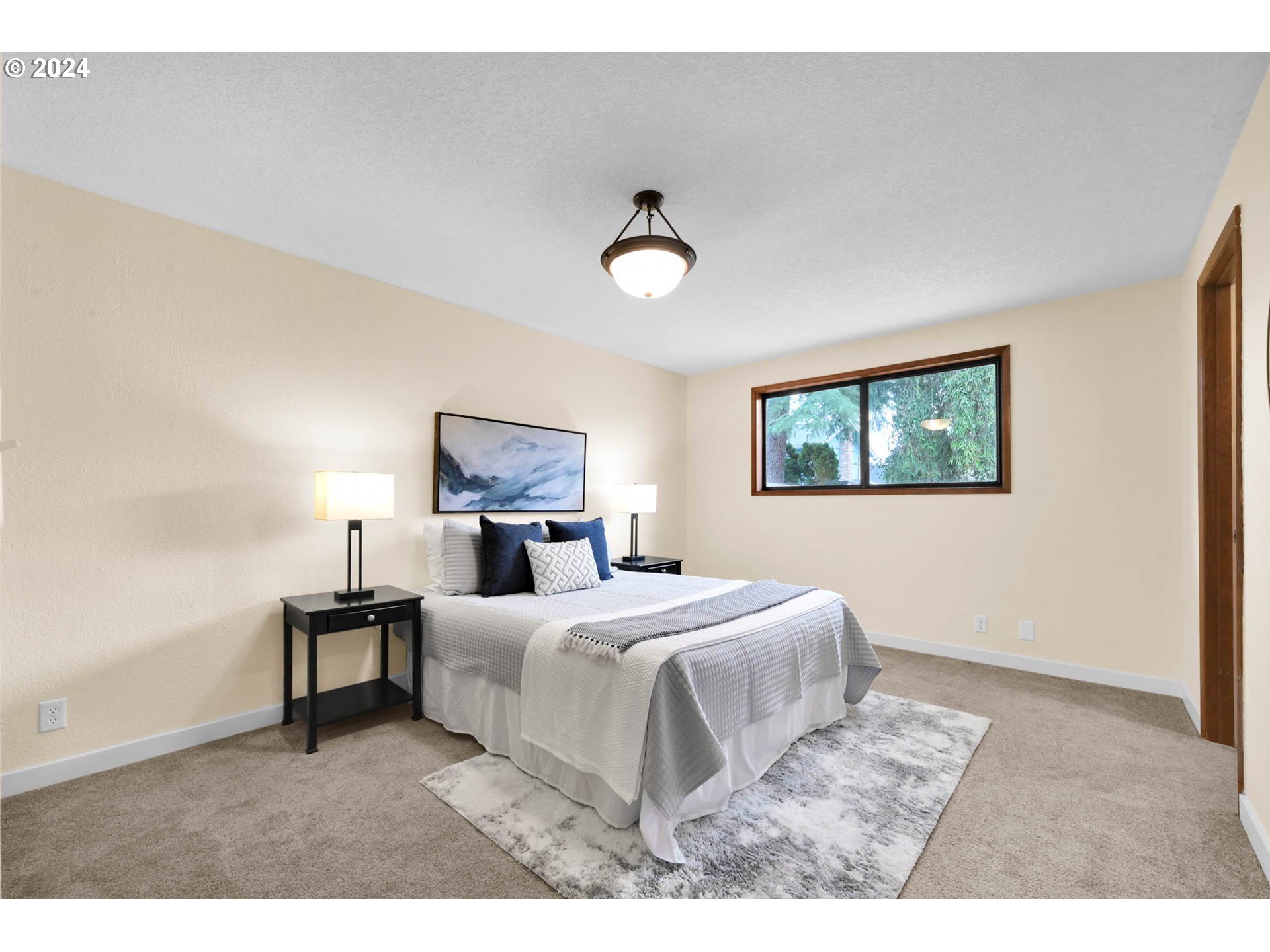 7136 B Street Springfield, OR 97478 - Photo 26 of 46 a bedroom with a bed and a lamp with window