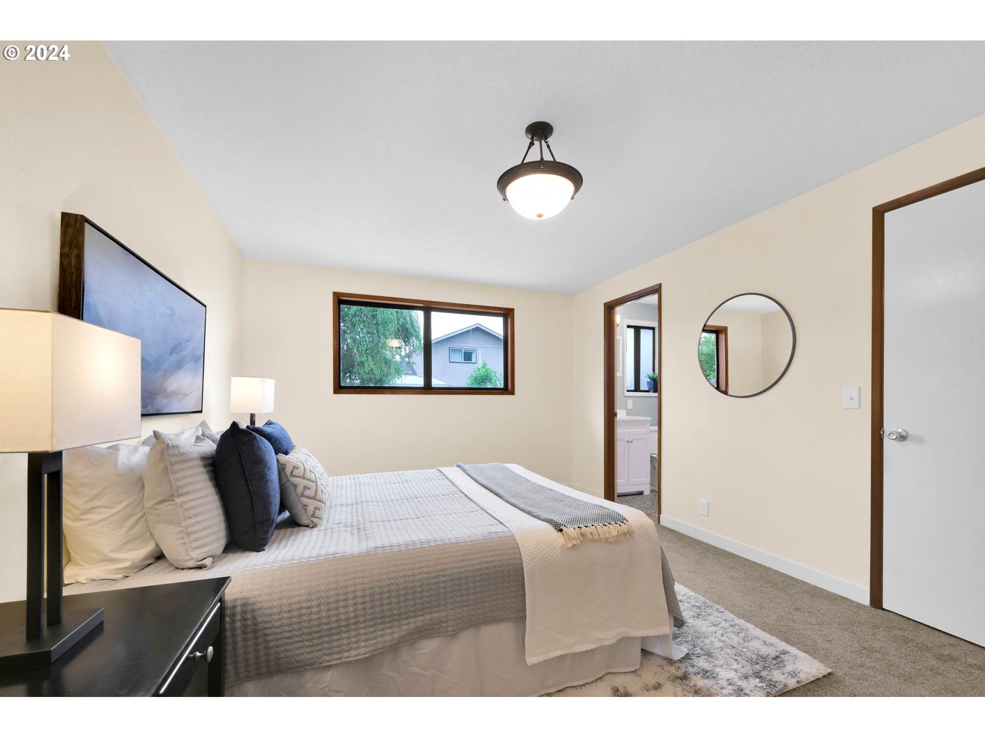 7136 B Street Springfield, OR 97478 - Photo 29 of 46 a bedroom with a bed and a painting on the wall