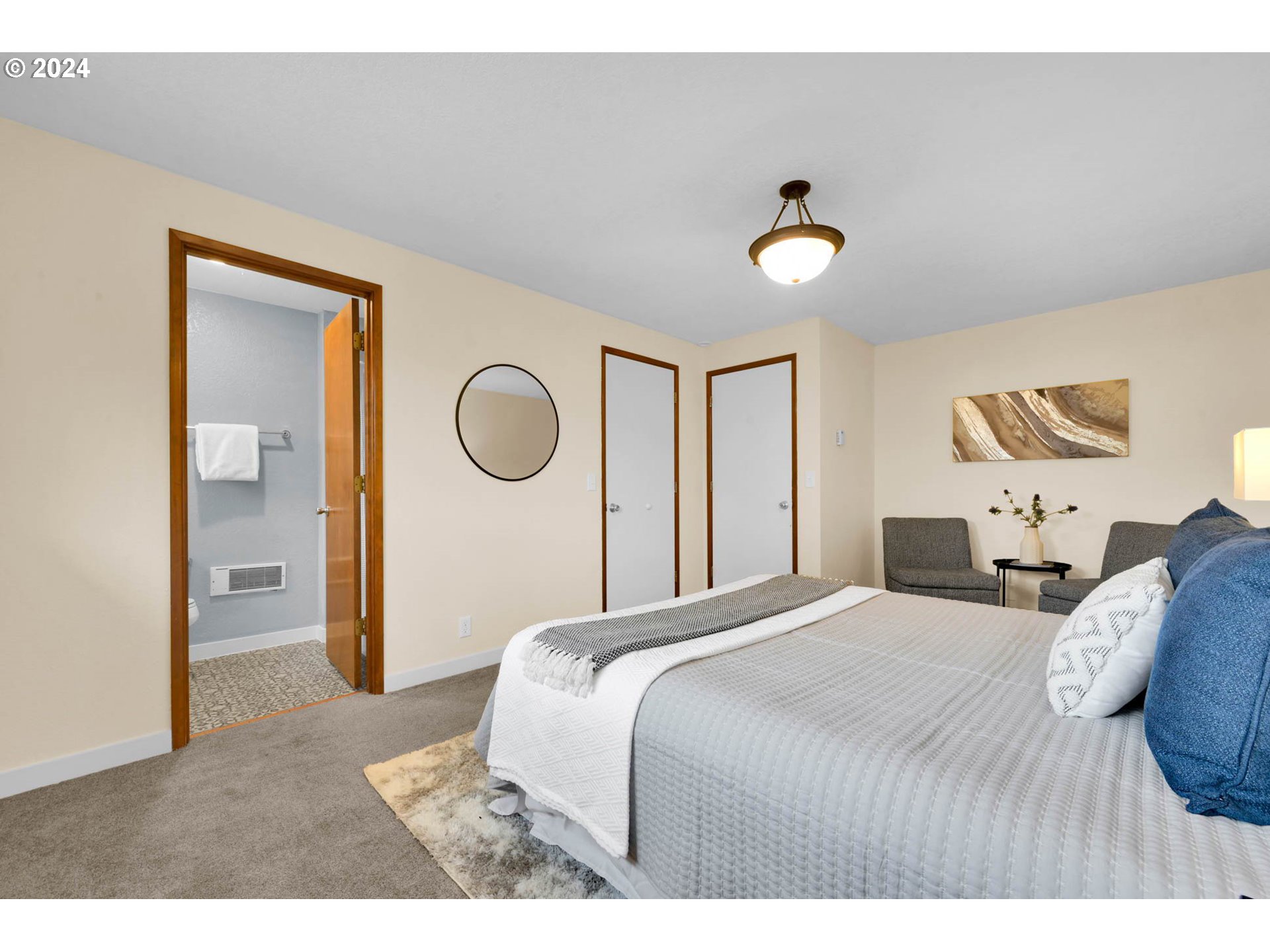 7136 B Street Springfield, OR 97478 - Photo 30 of 46 a bedroom with a bed and a chandelier