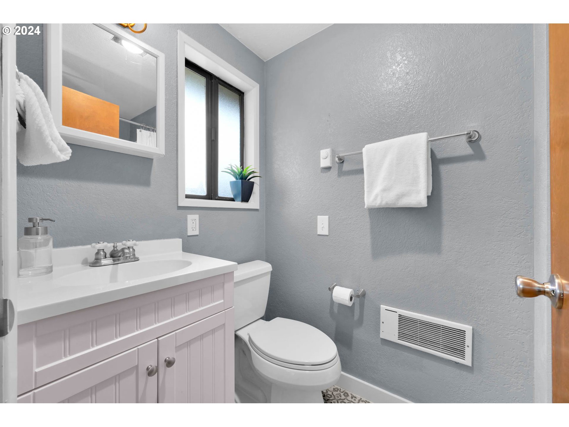 7136 B Street Springfield, OR 97478 - Photo 31 of 46 a bathroom with a sink toilet and mirror