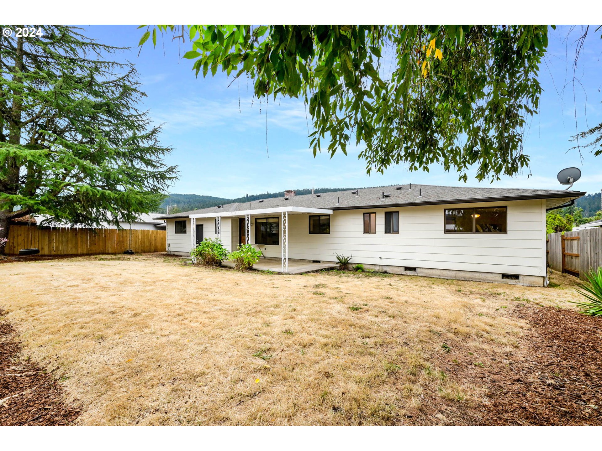 7136 B Street Springfield, OR 97478 - Photo 40 of 46 a view of a house with a yard