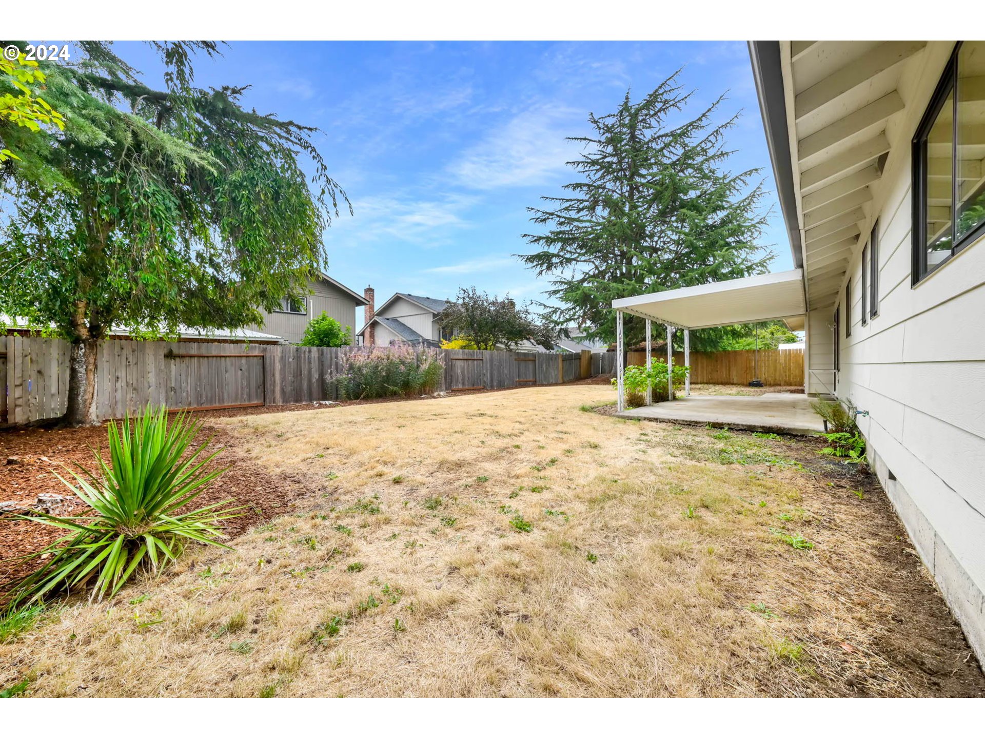 7136 B Street Springfield, OR 97478 - Photo 42 of 46 a view of a backyard with a garden