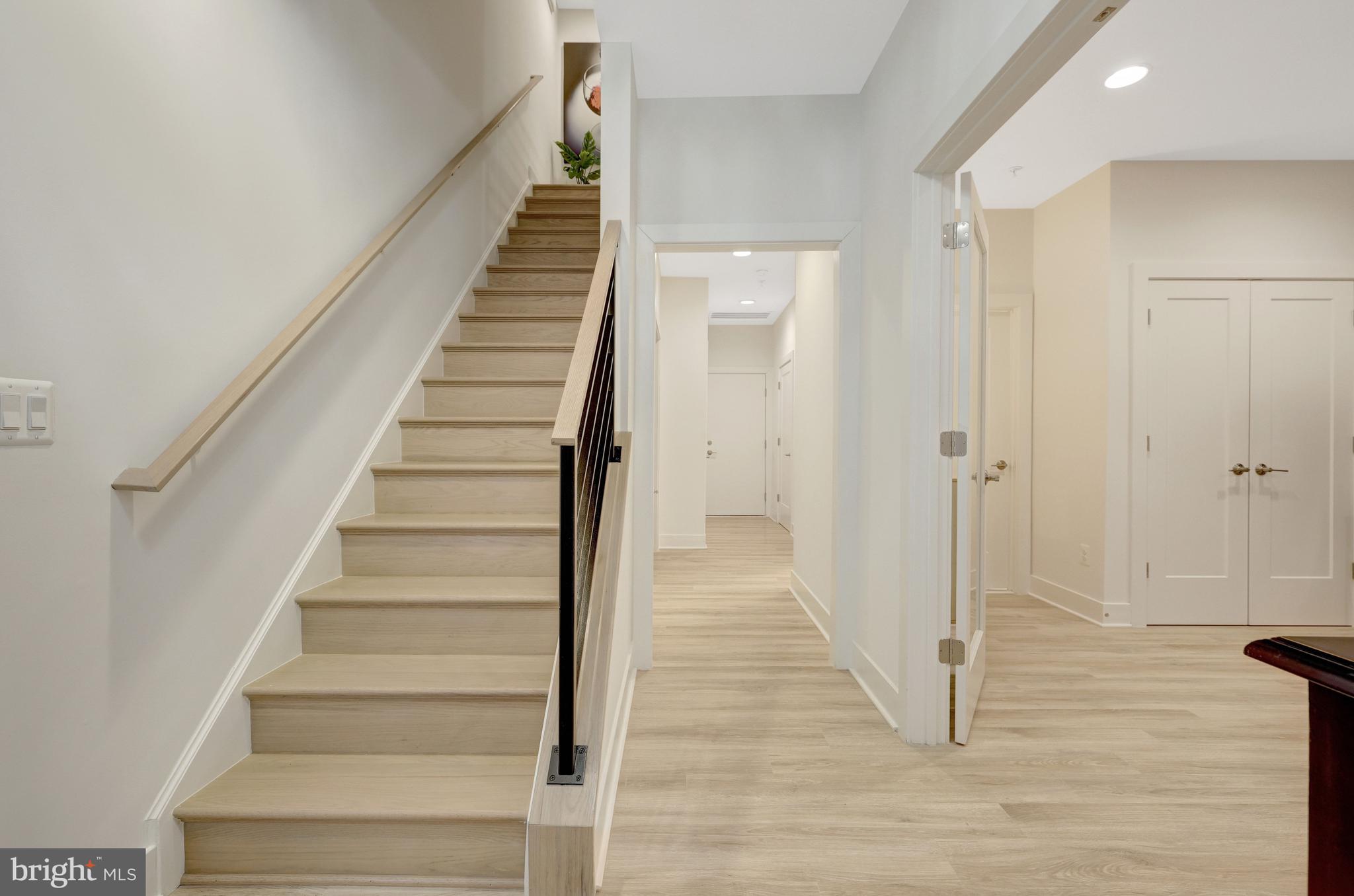 11236 Faraday Park Drive Reston, VA 20190 - Photo 11 of 74 Oak stairs with steel railings lead to main level.