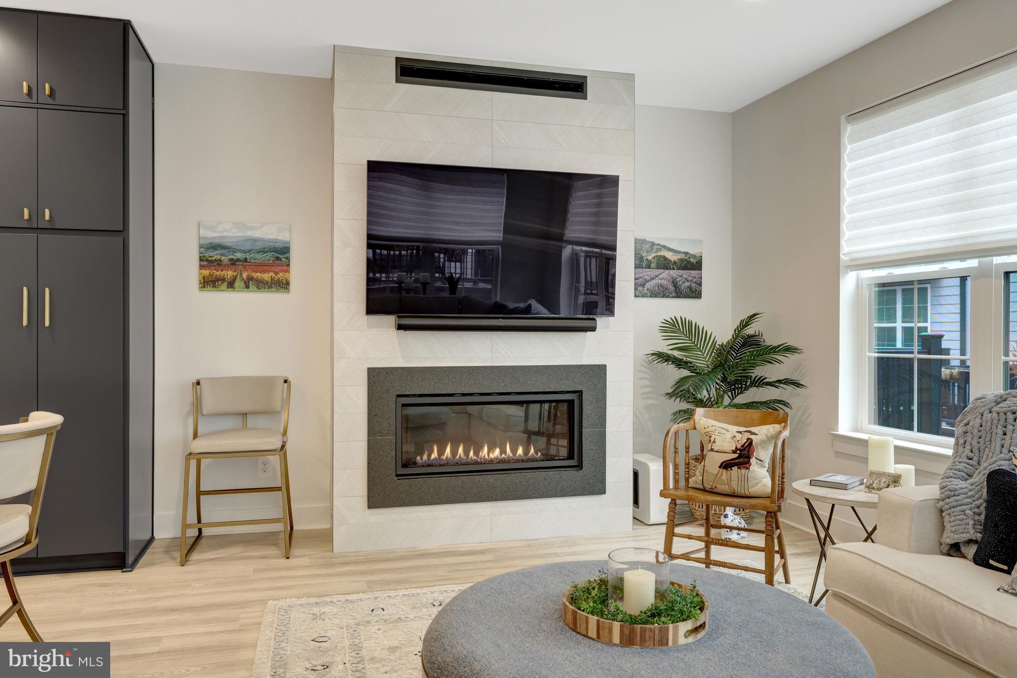11236 Faraday Park Drive Reston, VA 20190 - Photo 21 of 74 a living room with furniture and a fireplace