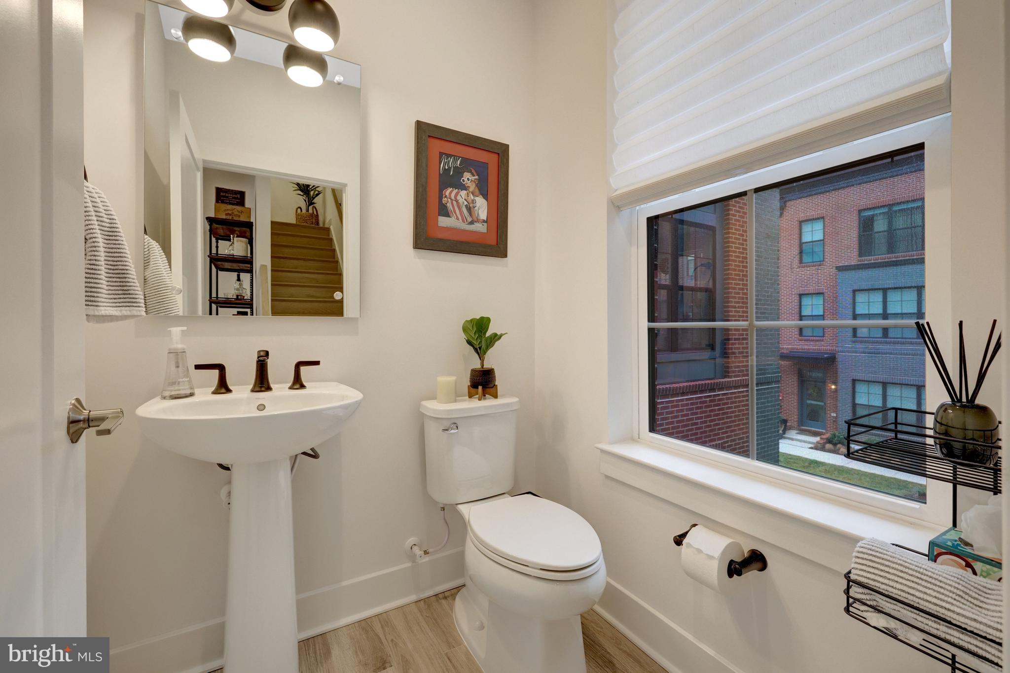 11236 Faraday Park Drive Reston, VA 20190 - Photo 28 of 74 a bathroom with a sink a toilet and shower