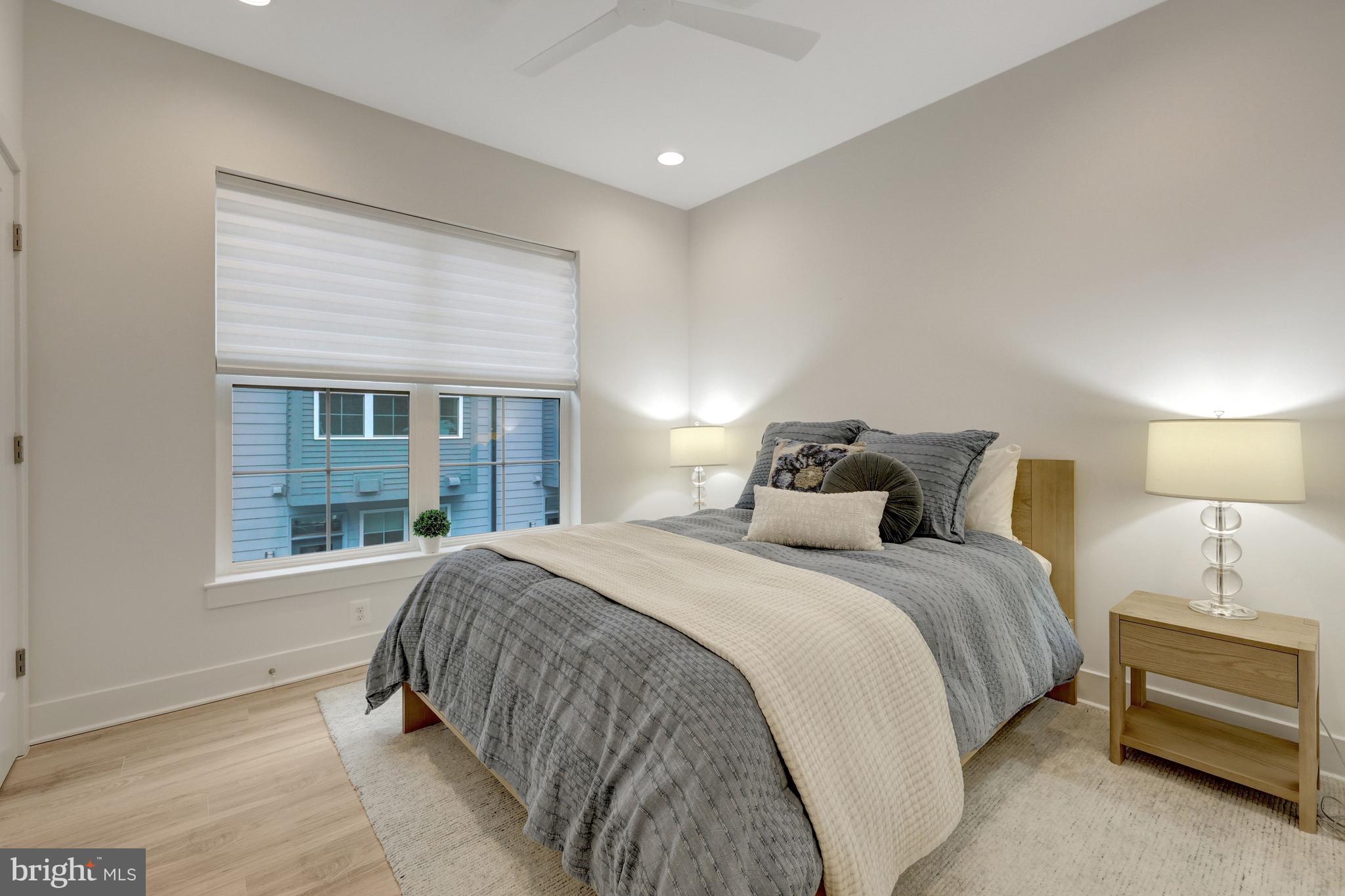 11236 Faraday Park Drive Reston, VA 20190 - Photo 40 of 74 Bedroom #3 has a ceiling fan, LVP floors & blinds.