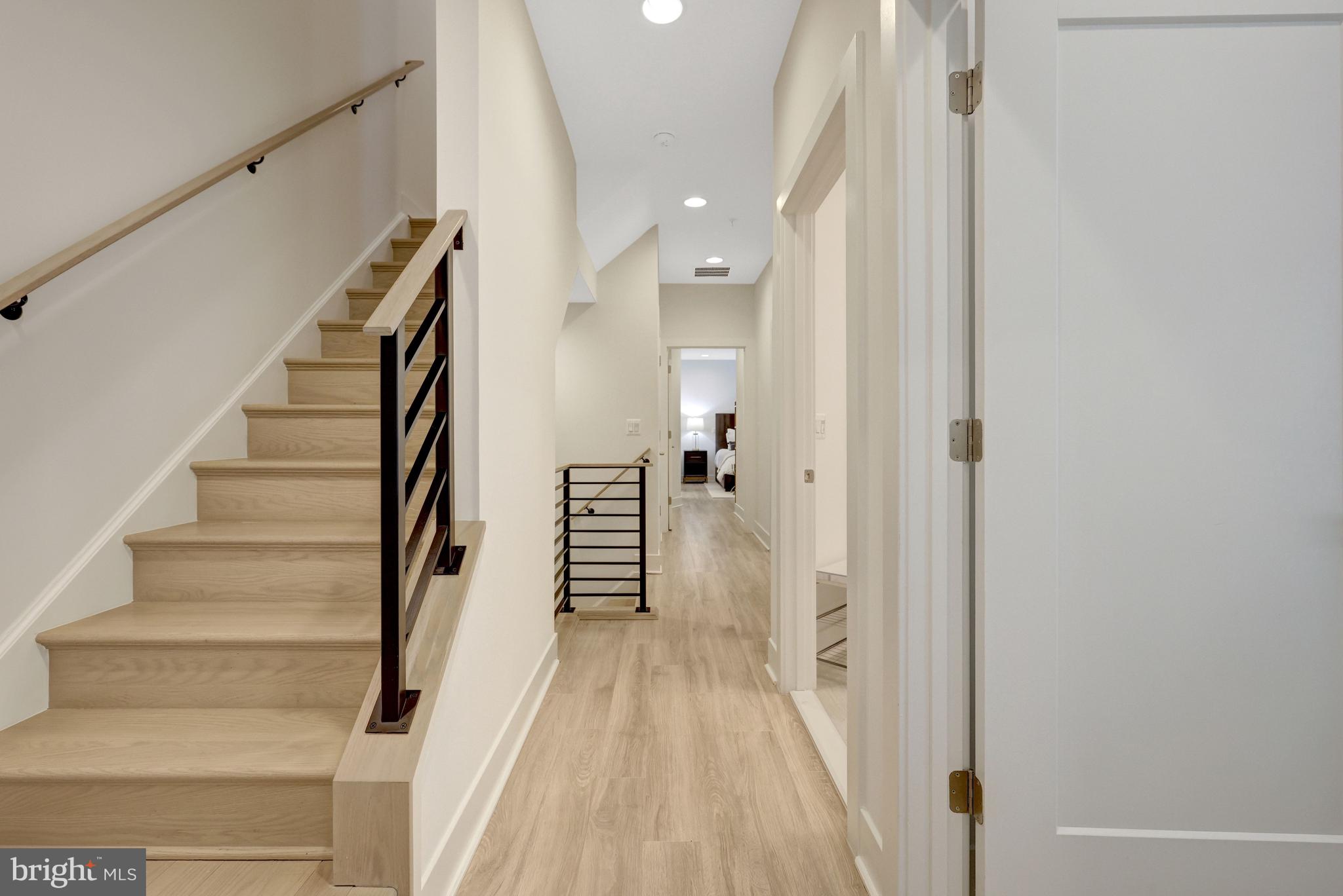 11236 Faraday Park Drive Reston, VA 20190 - Photo 42 of 74 Beautiful oak stairs and steel railings.