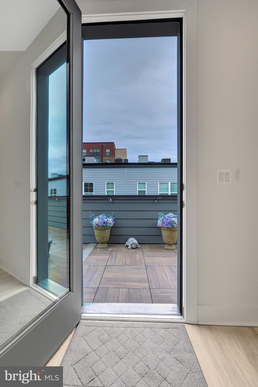 11236 Faraday Park Drive Reston, VA 20190 - Photo 44 of 74 Glass door leads to the rooftop terrace.