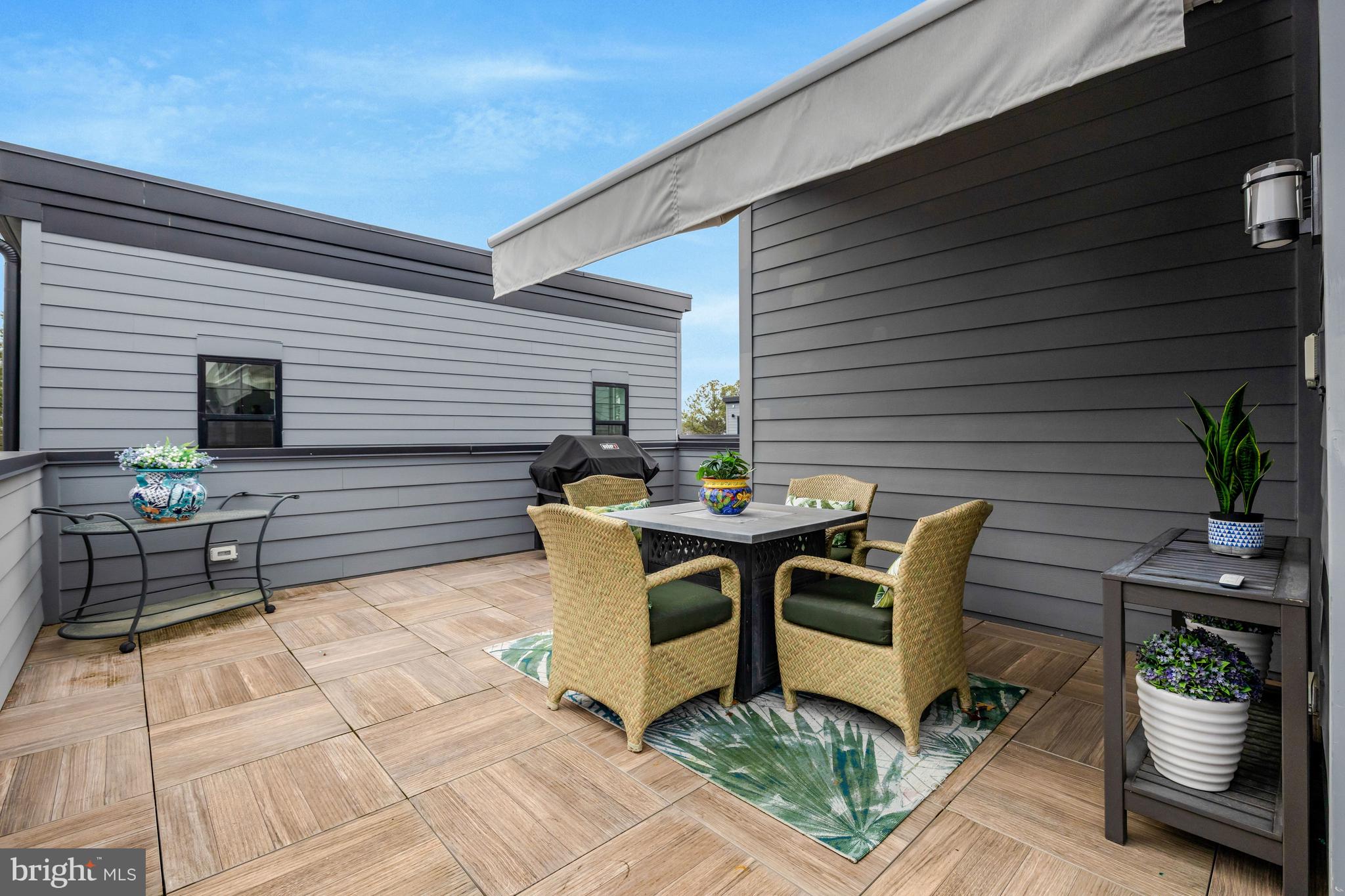 11236 Faraday Park Drive Reston, VA 20190 - Photo 49 of 74 a view of a dinning table and chairs in the patio