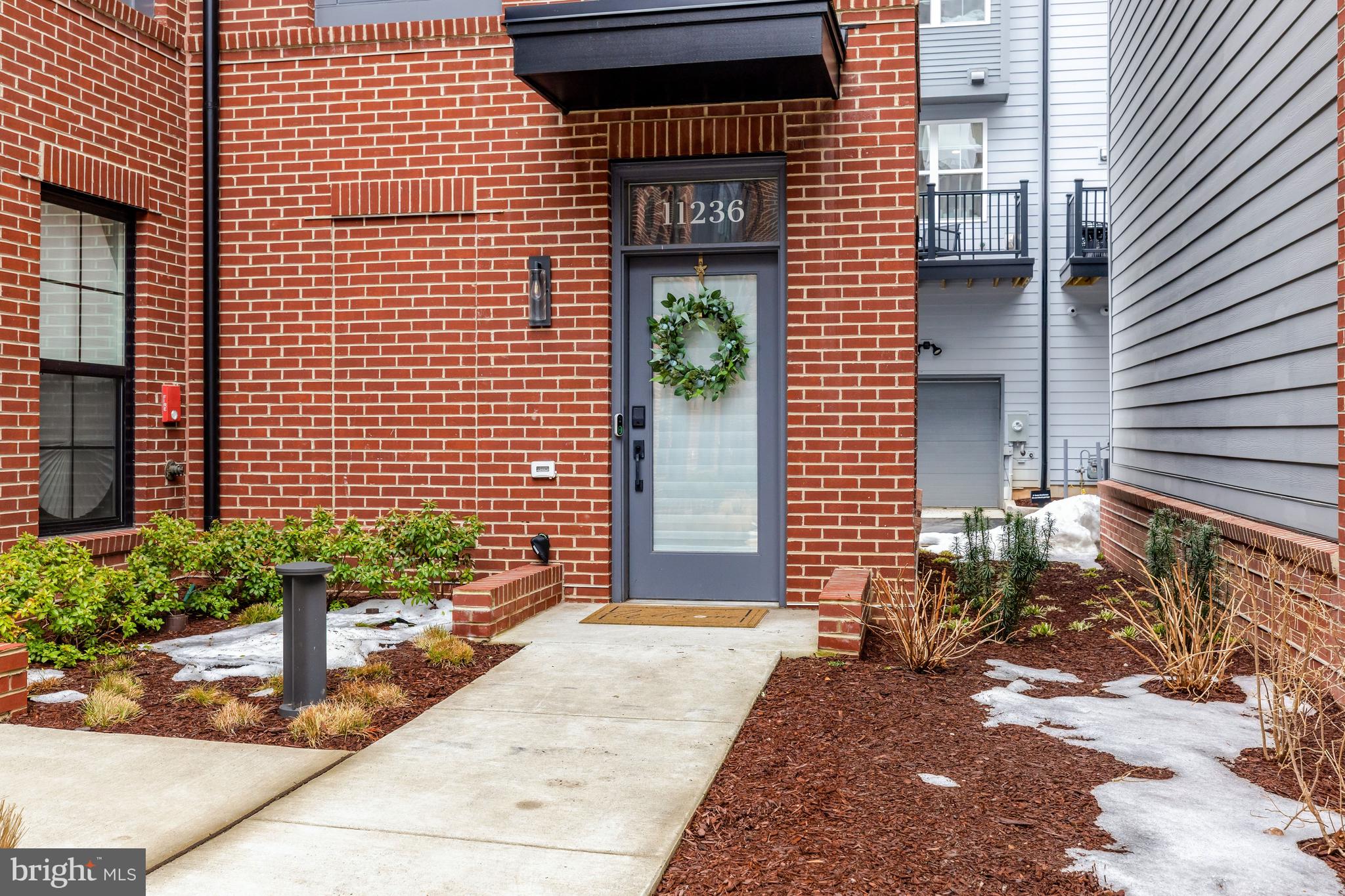 11236 Faraday Park Drive Reston, VA 20190 - Photo 5 of 74 The sidewalk leads to the welcoming front entrance