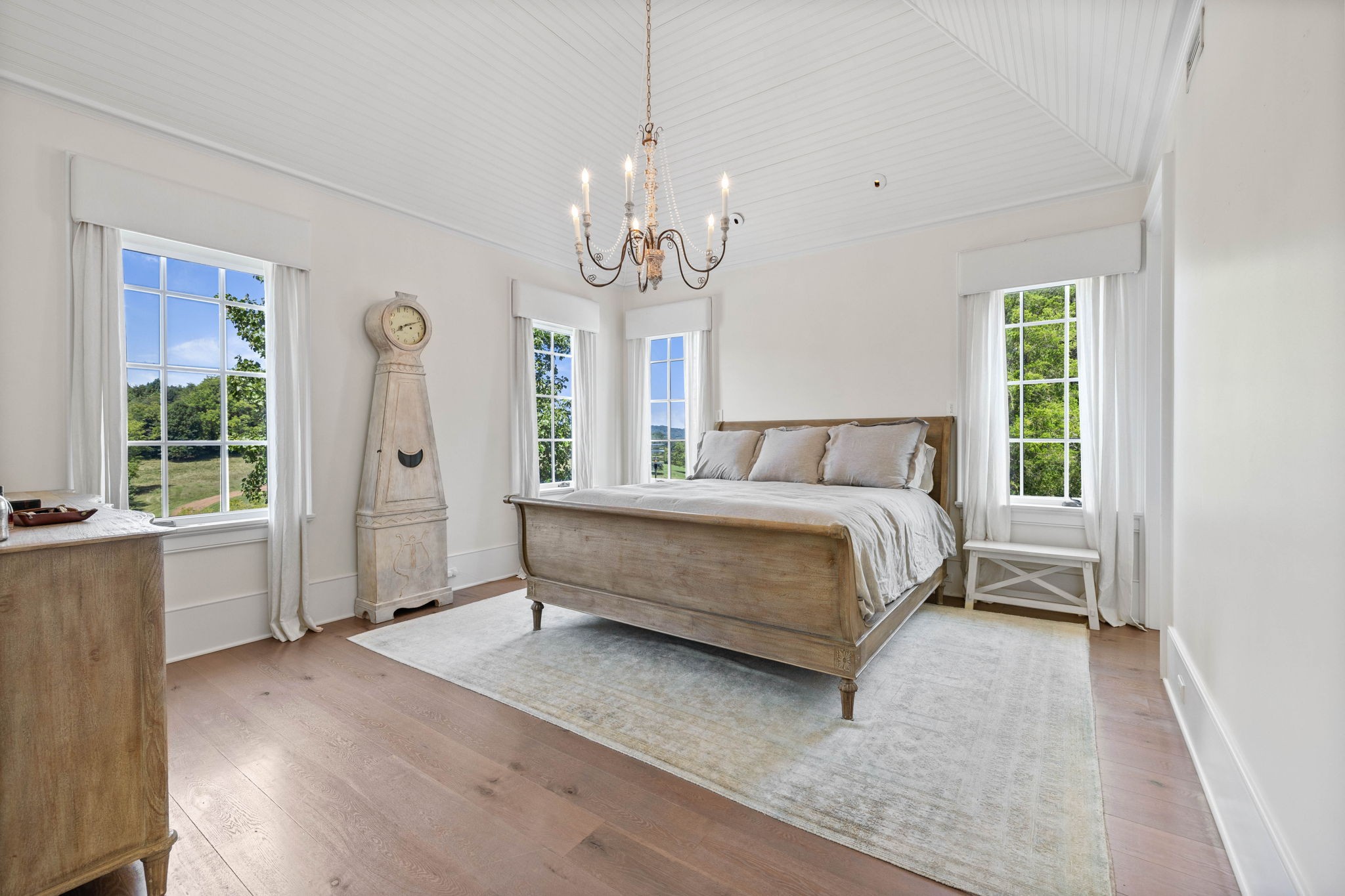 3385 Bailey Road Franklin, TN 37064 - Photo 20 of 56 a bedroom with a large bed chandelier and a window