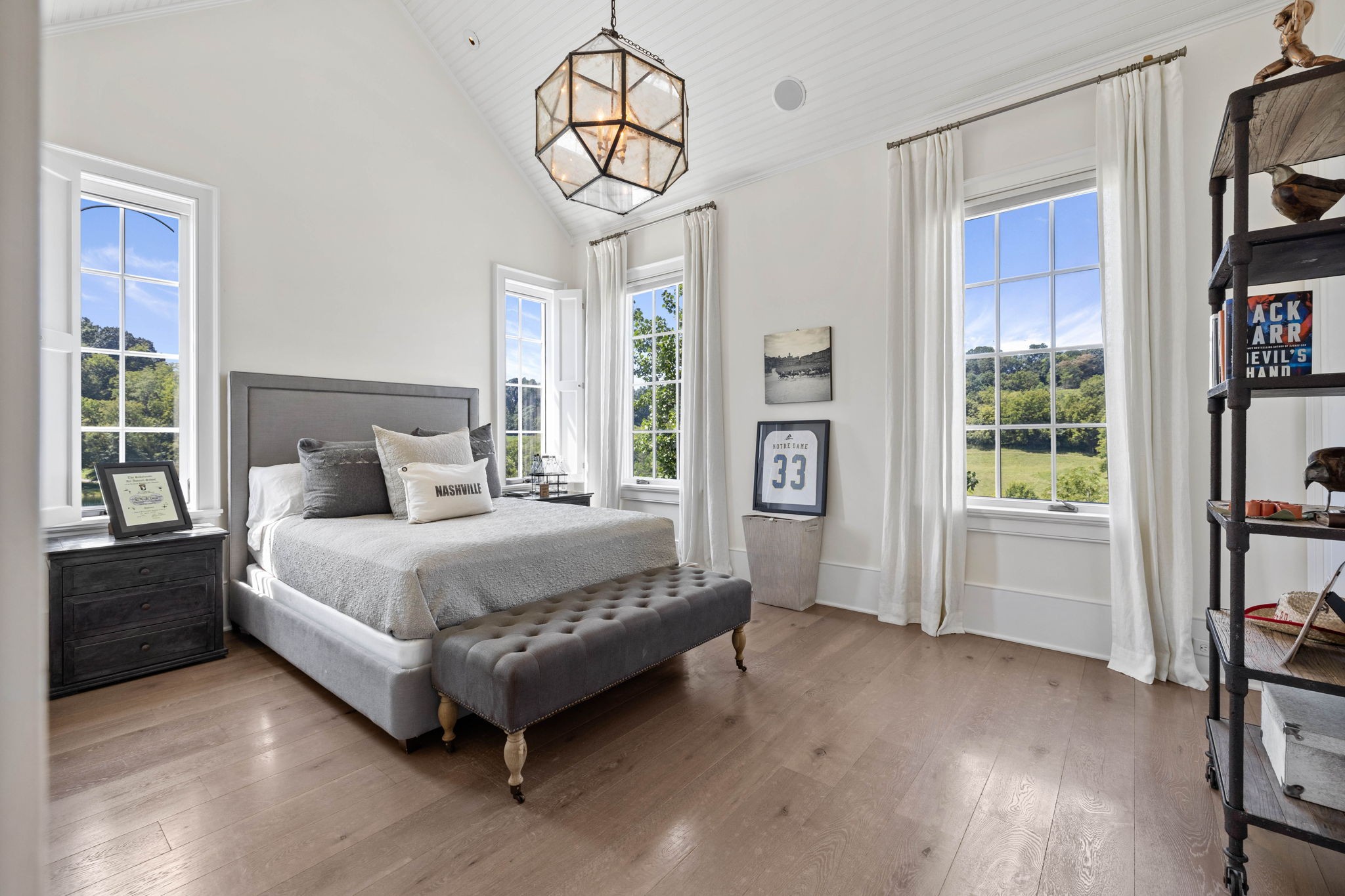 3385 Bailey Road Franklin, TN 37064 - Photo 25 of 56 a spacious bedroom with a bed and a chandelier