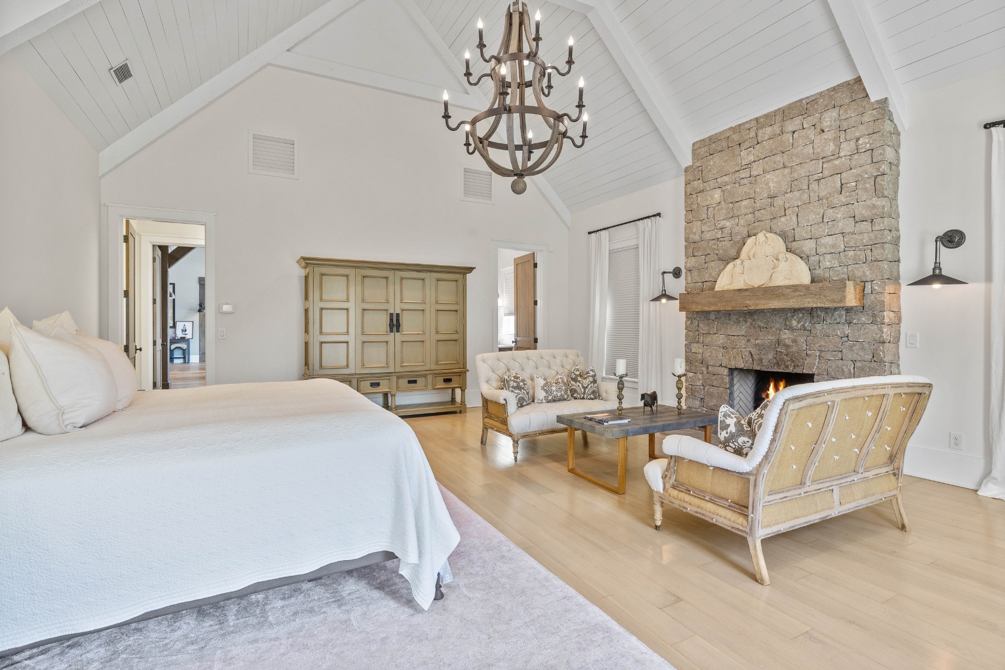 3385 Bailey Road Franklin, TN 37064 - Photo 51 of 56 a spacious bedroom with a bed a couch and a chandelier