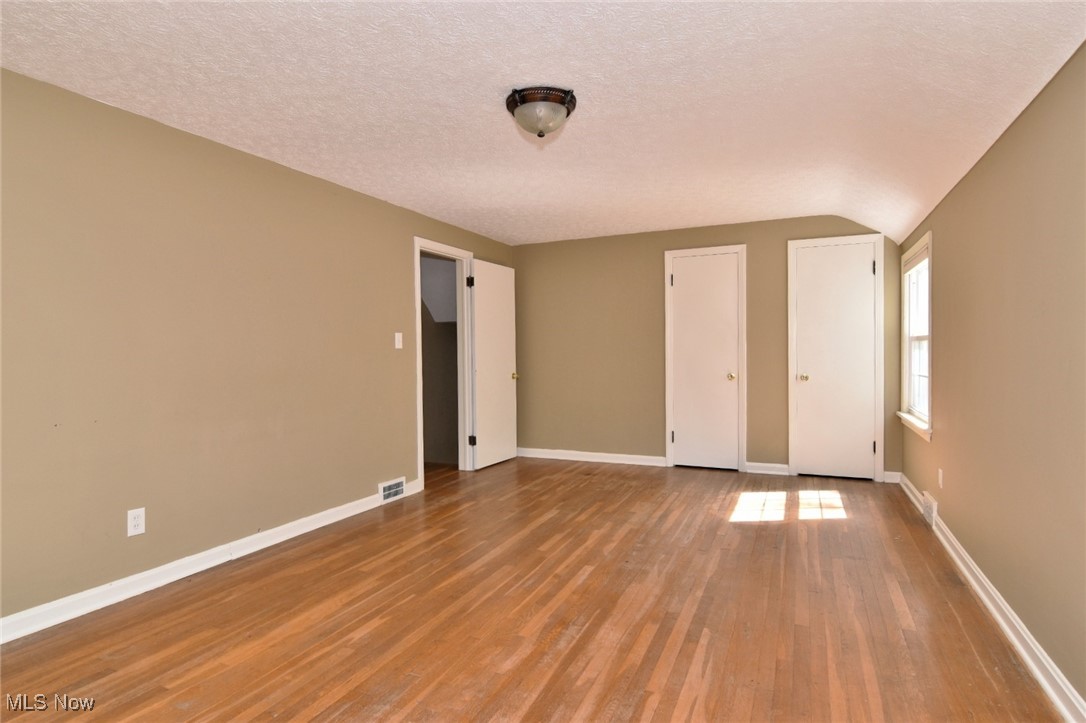 3679 Fenley Road Cleveland Heights, OH 44121 - Photo 25 of 45 Unfurnished bedroom featuring a textured ceiling and wood finished floors