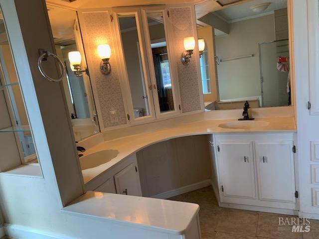 175 Westgate Circle Santa Rosa, CA 95401 - Photo 16 of 17 a bathroom with a sink and a mirror
